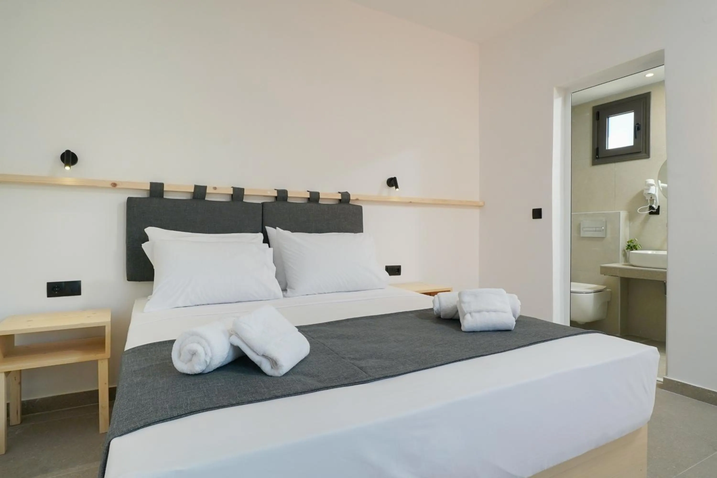 Bed in Emerial Deluxe Seaside Rooms