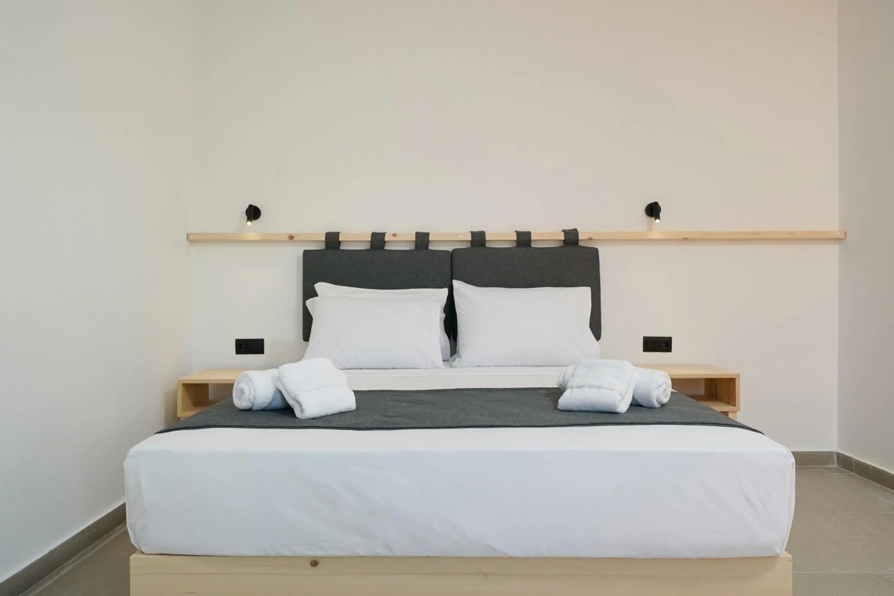 Bed in Emerial Deluxe Seaside Rooms