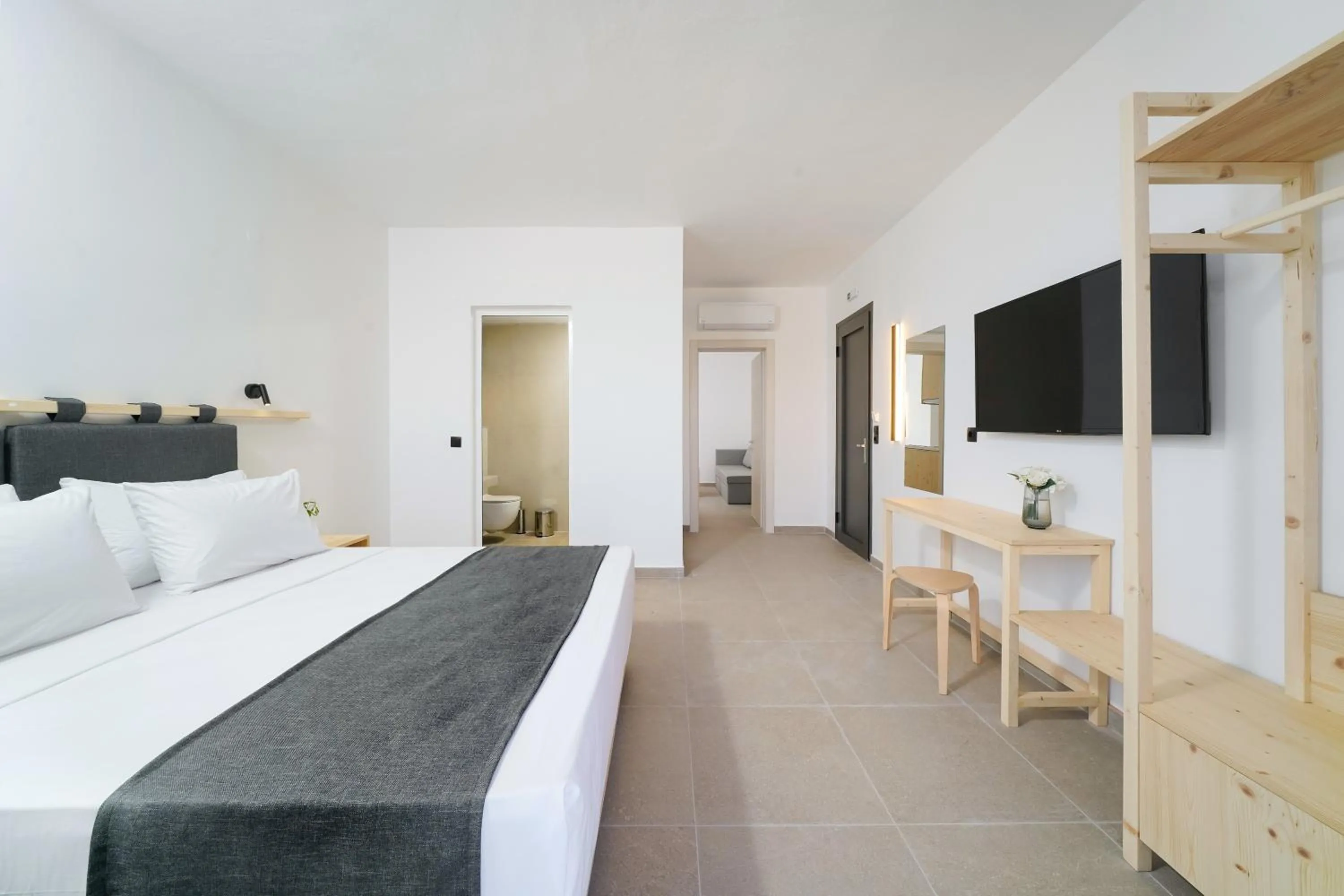 Bed in Emerial Deluxe Seaside Rooms
