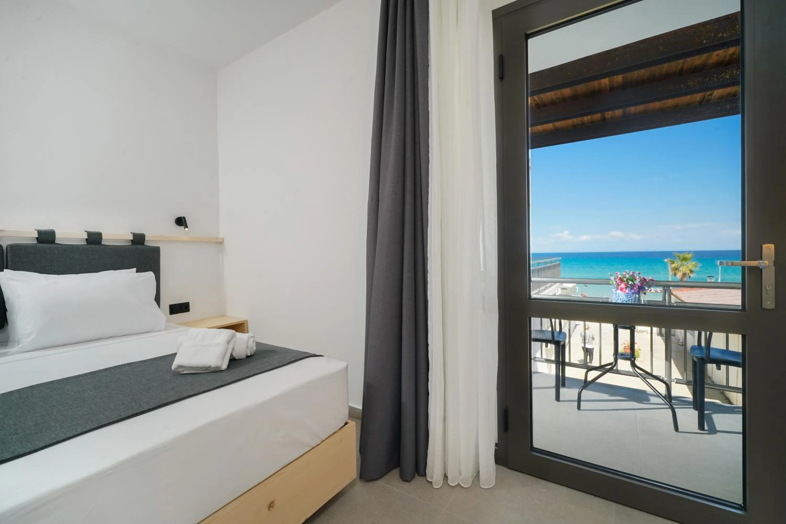 View (from property/room), Bed in Emerial Deluxe Seaside Rooms