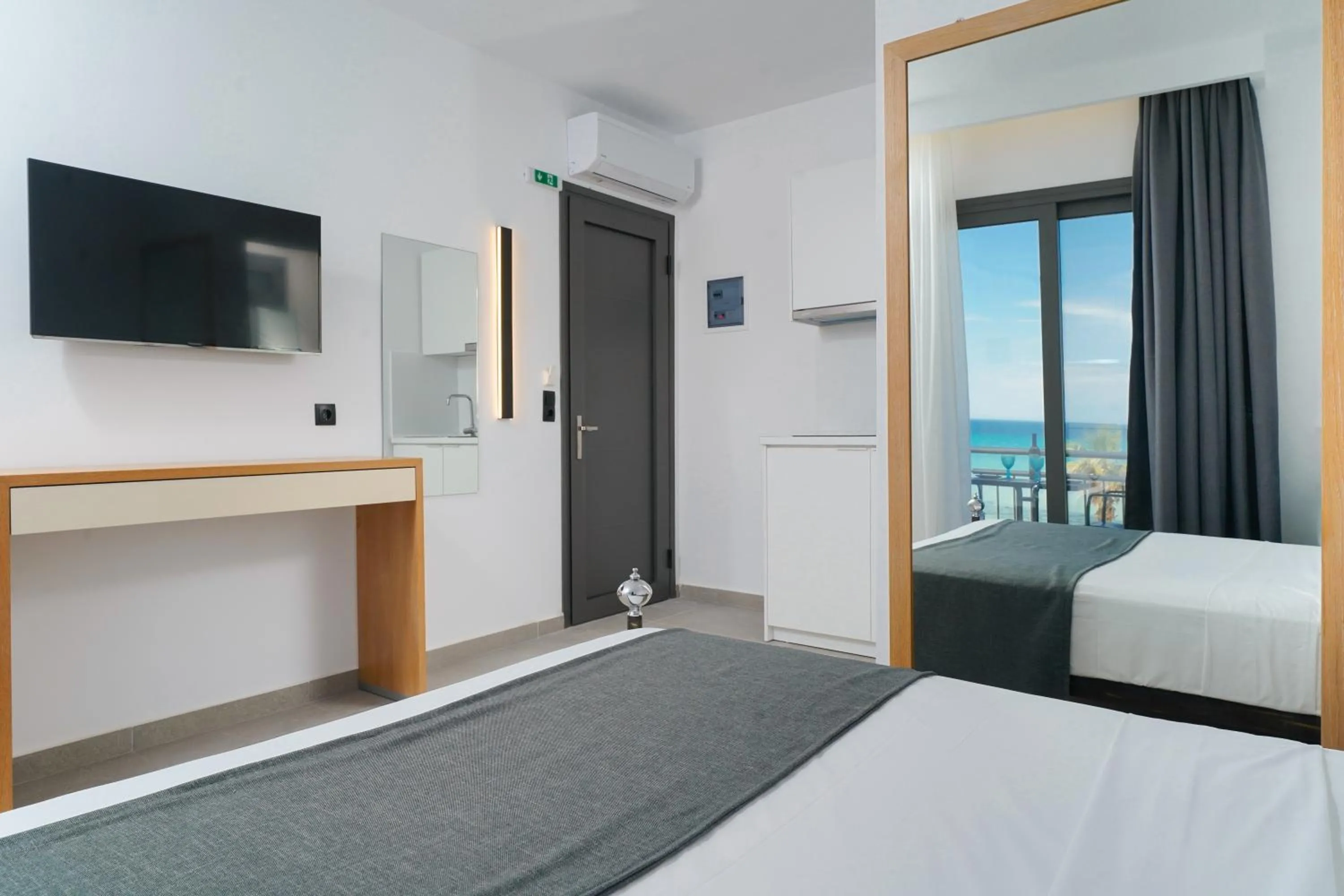 Bed in Emerial Deluxe Seaside Rooms
