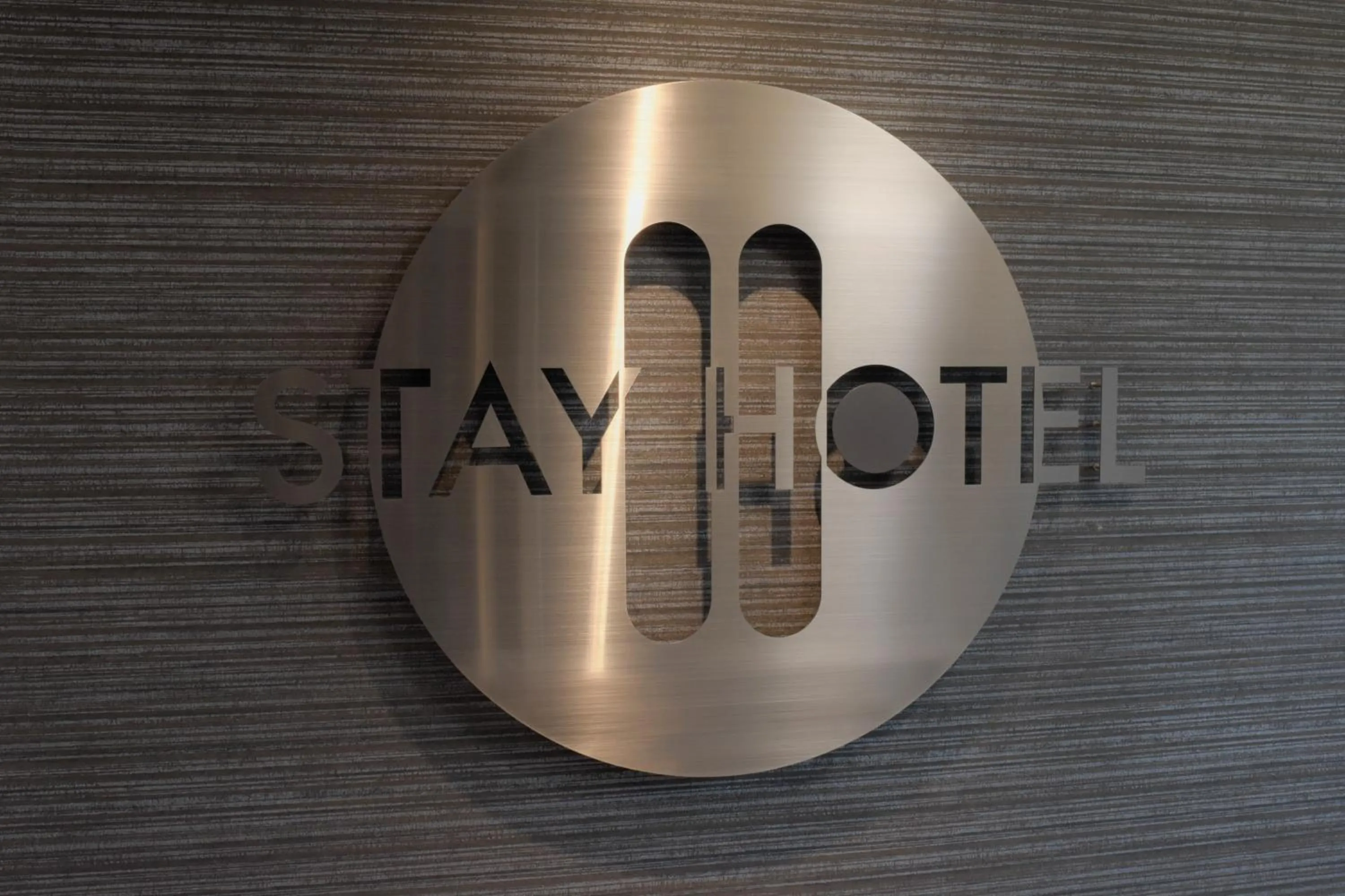 Property logo or sign in Stay HOTEL