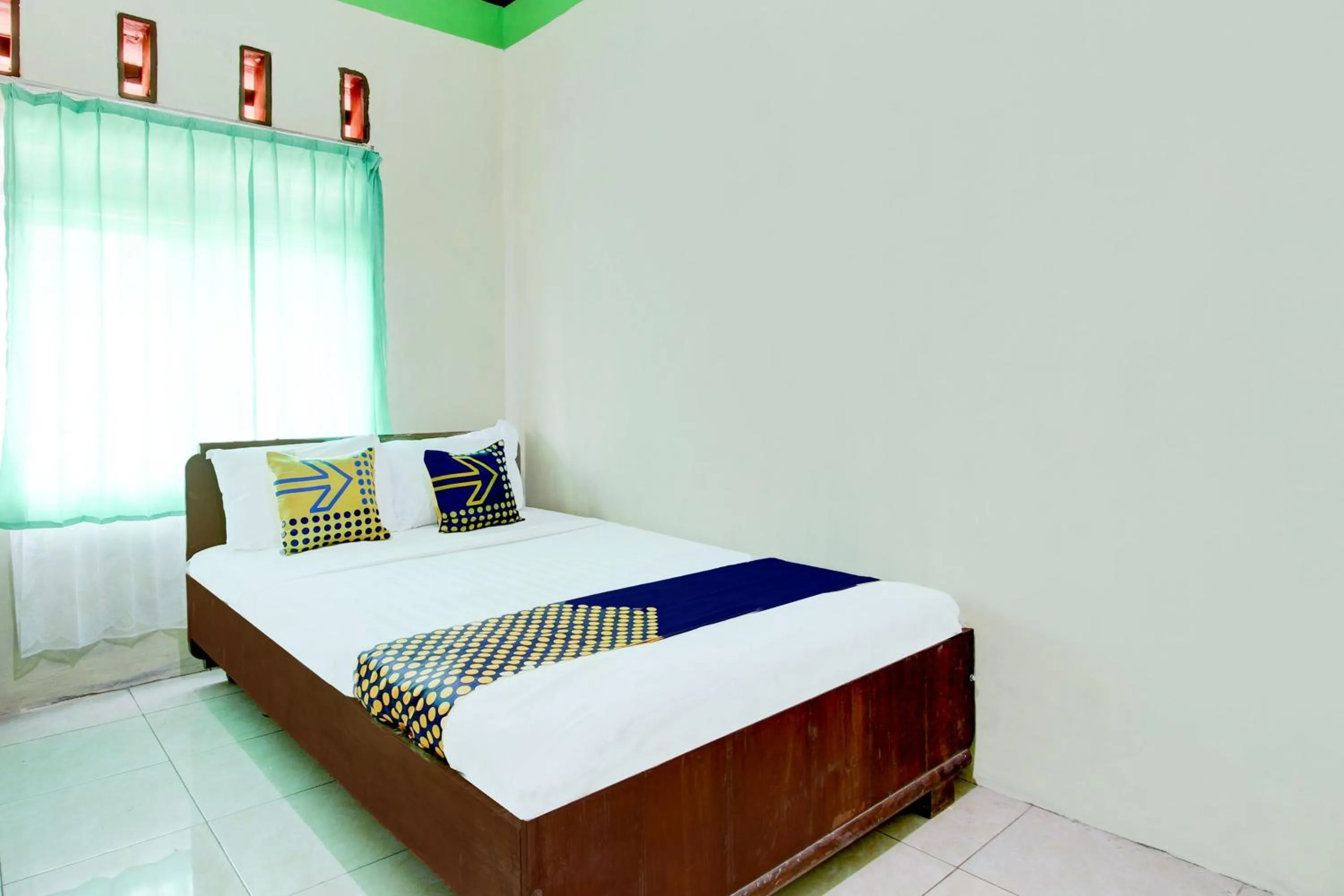 Bedroom in Hotel O Homestay Bintang Syariah