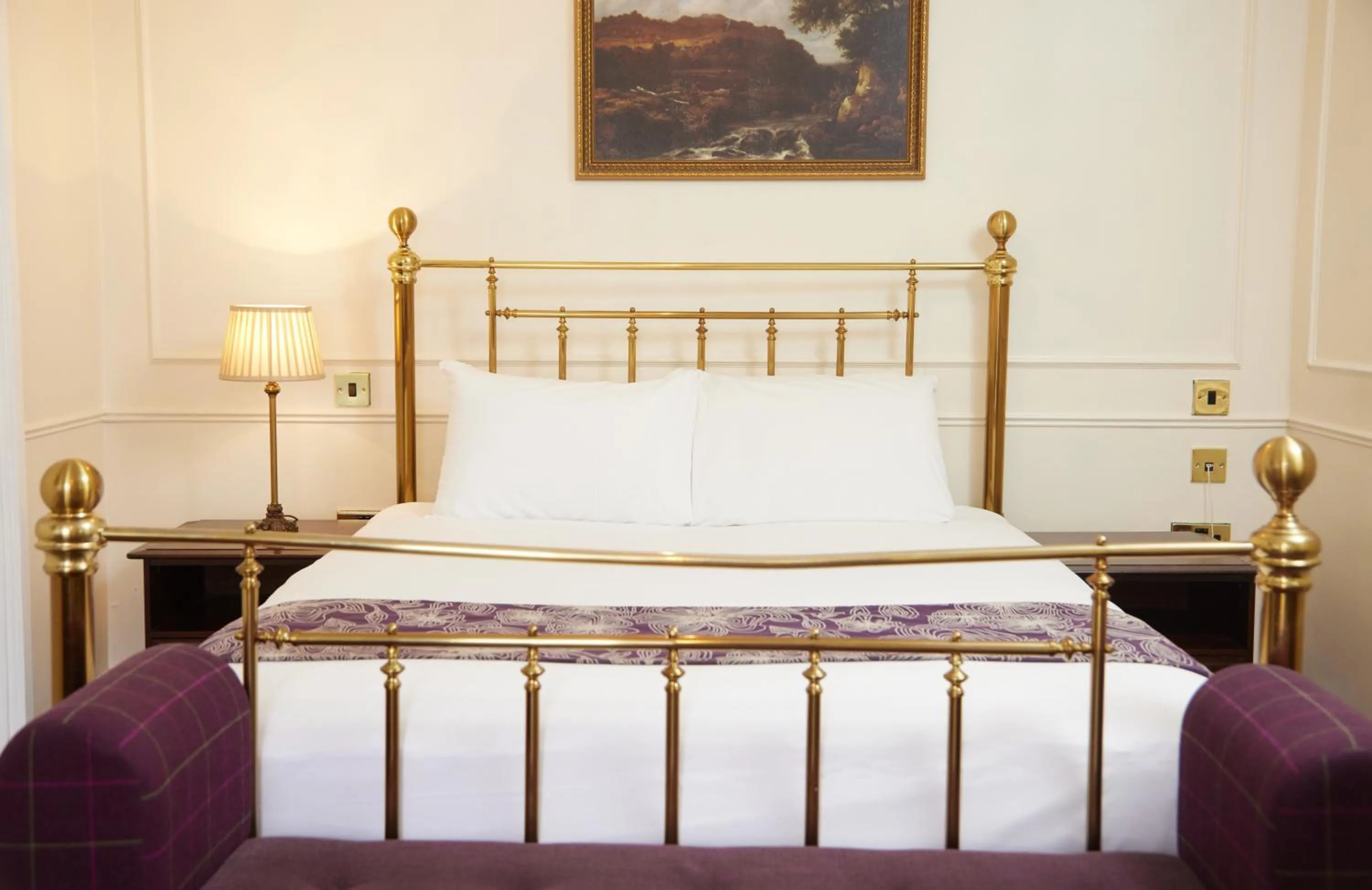 Bed in Cock Hotel by Greene King Inns