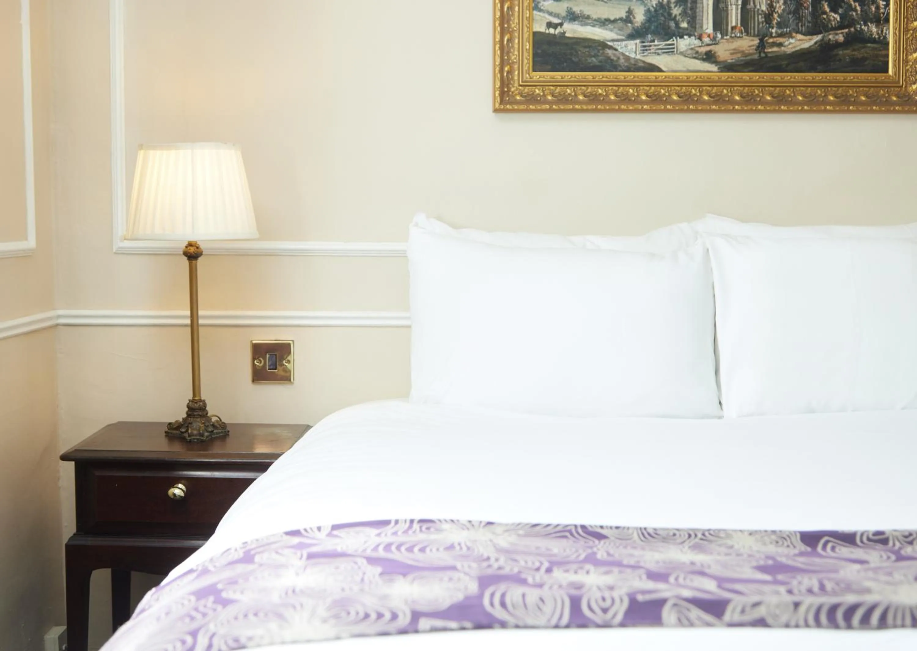 Bed in Cock Hotel by Greene King Inns