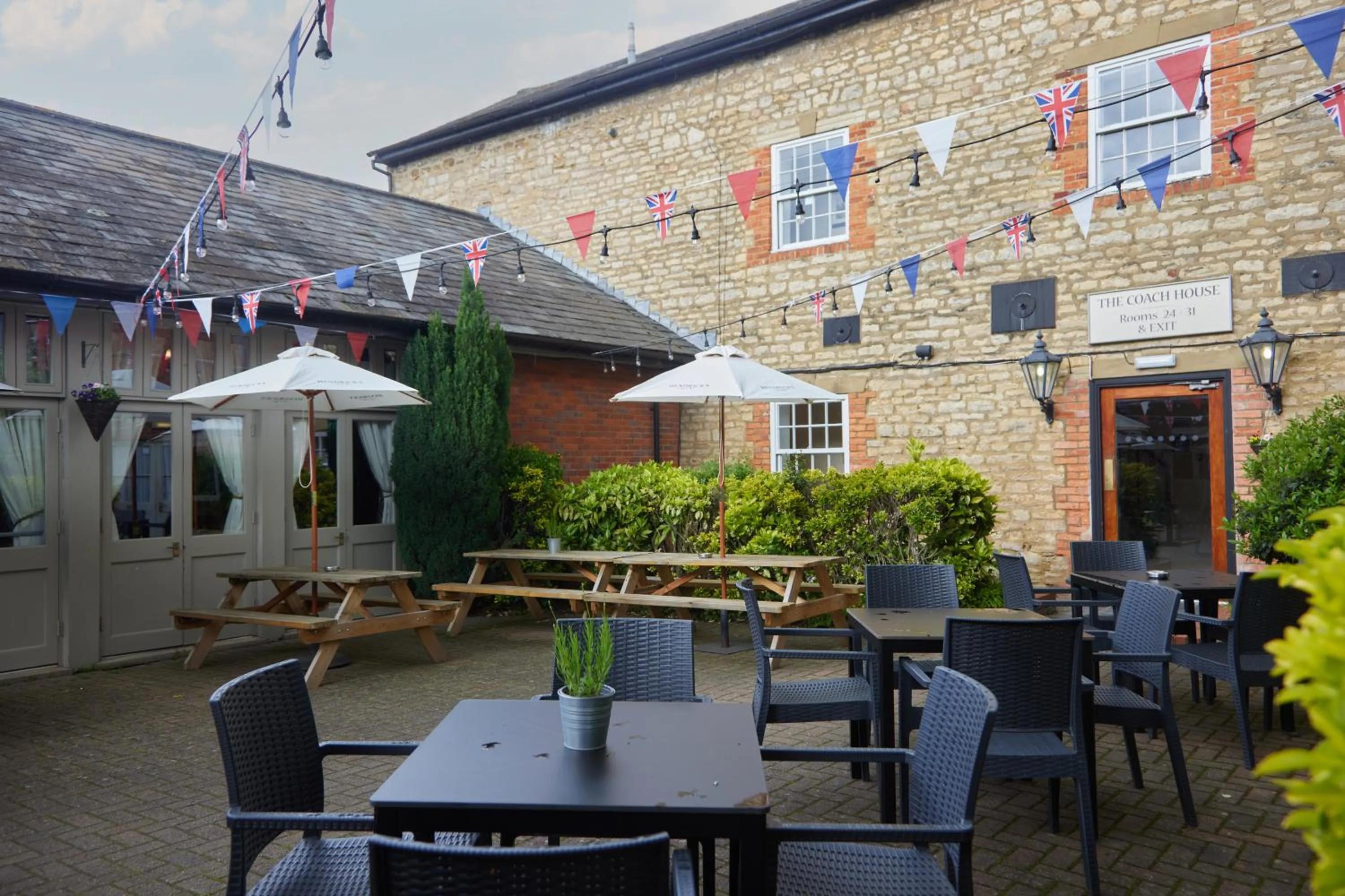 Patio in Cock Hotel by Greene King Inns