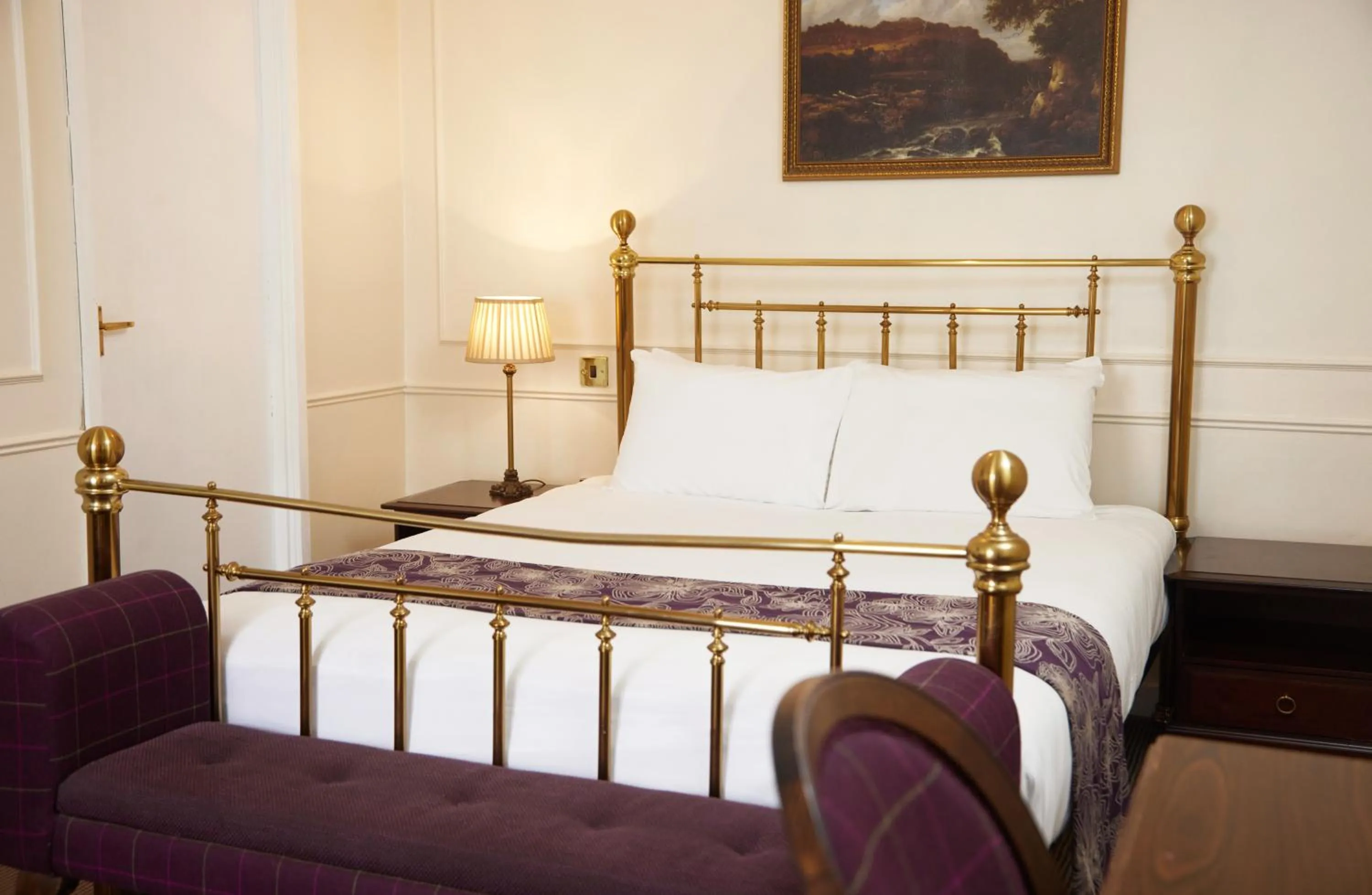 Bed in Cock Hotel by Greene King Inns