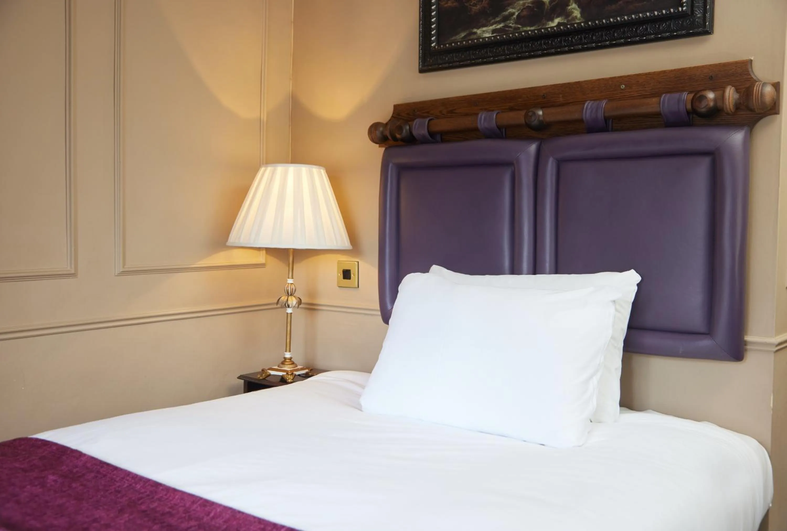 Bed in Cock Hotel by Greene King Inns