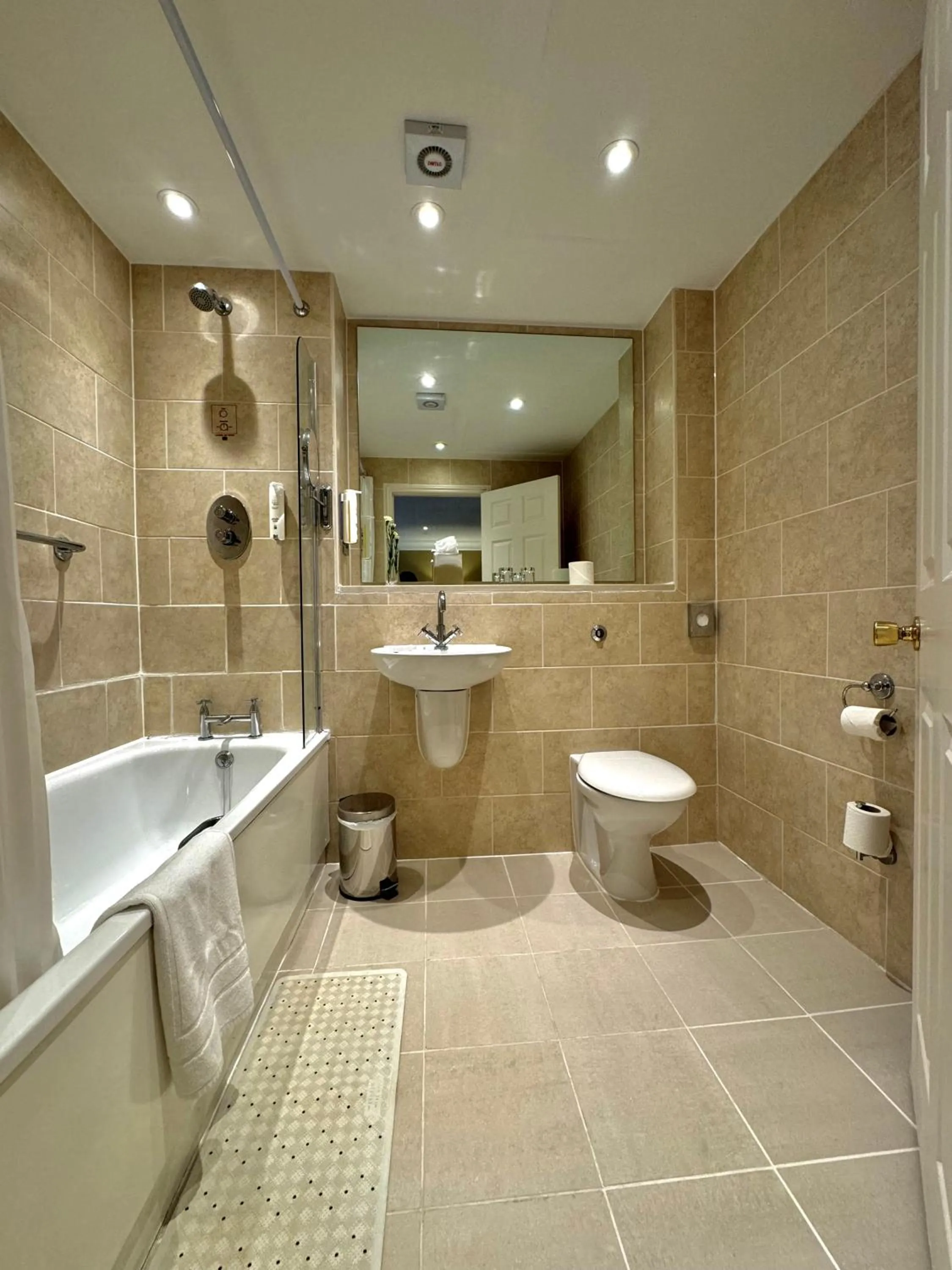 Bathroom in Grovefield House Hotel By Uno