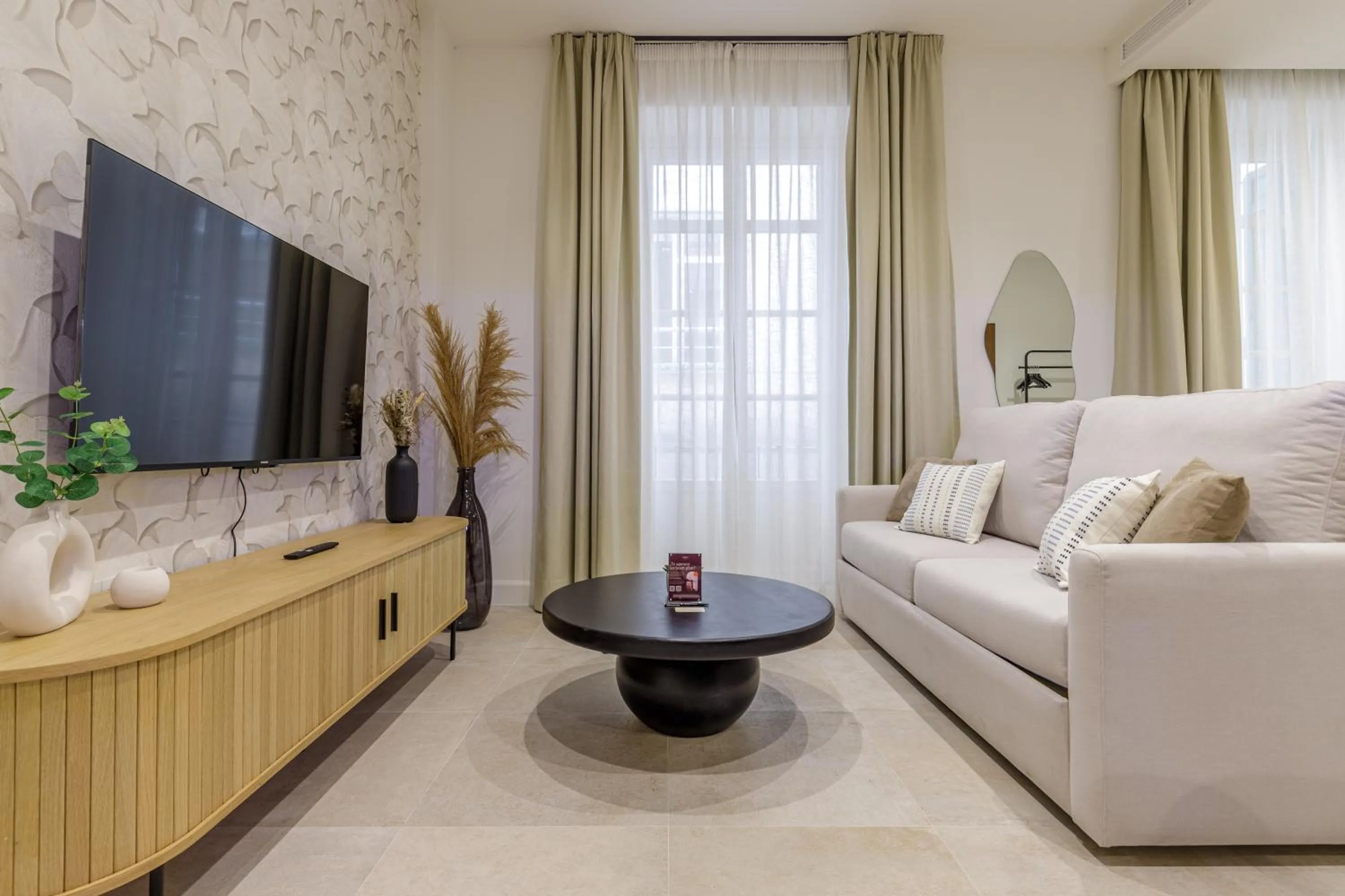Communal lounge/ TV room in Plaza del Siglo Suites & Boutique Apartments by Caleta Homes