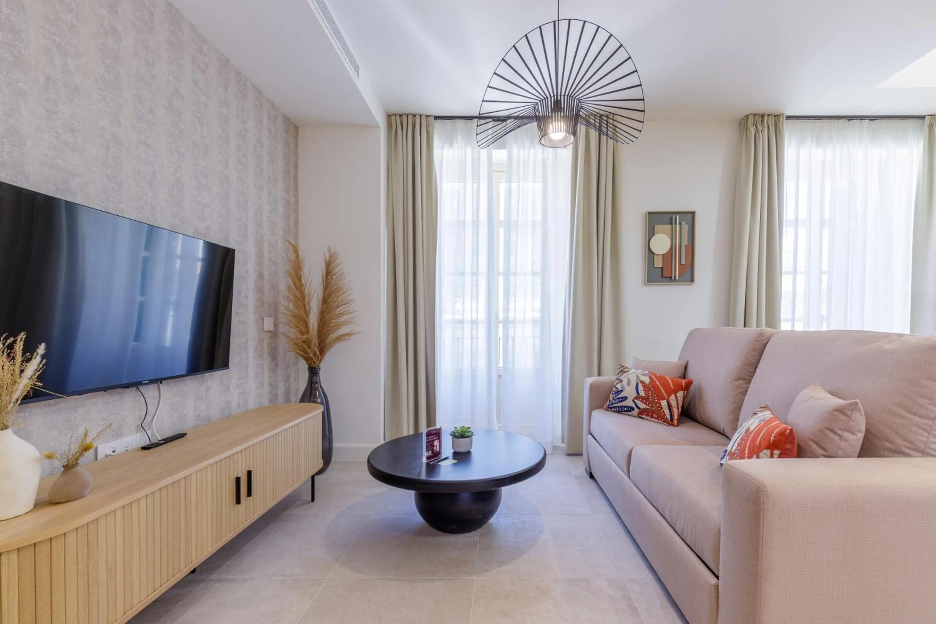Communal lounge/ TV room in Plaza del Siglo Suites & Boutique Apartments by Caleta Homes