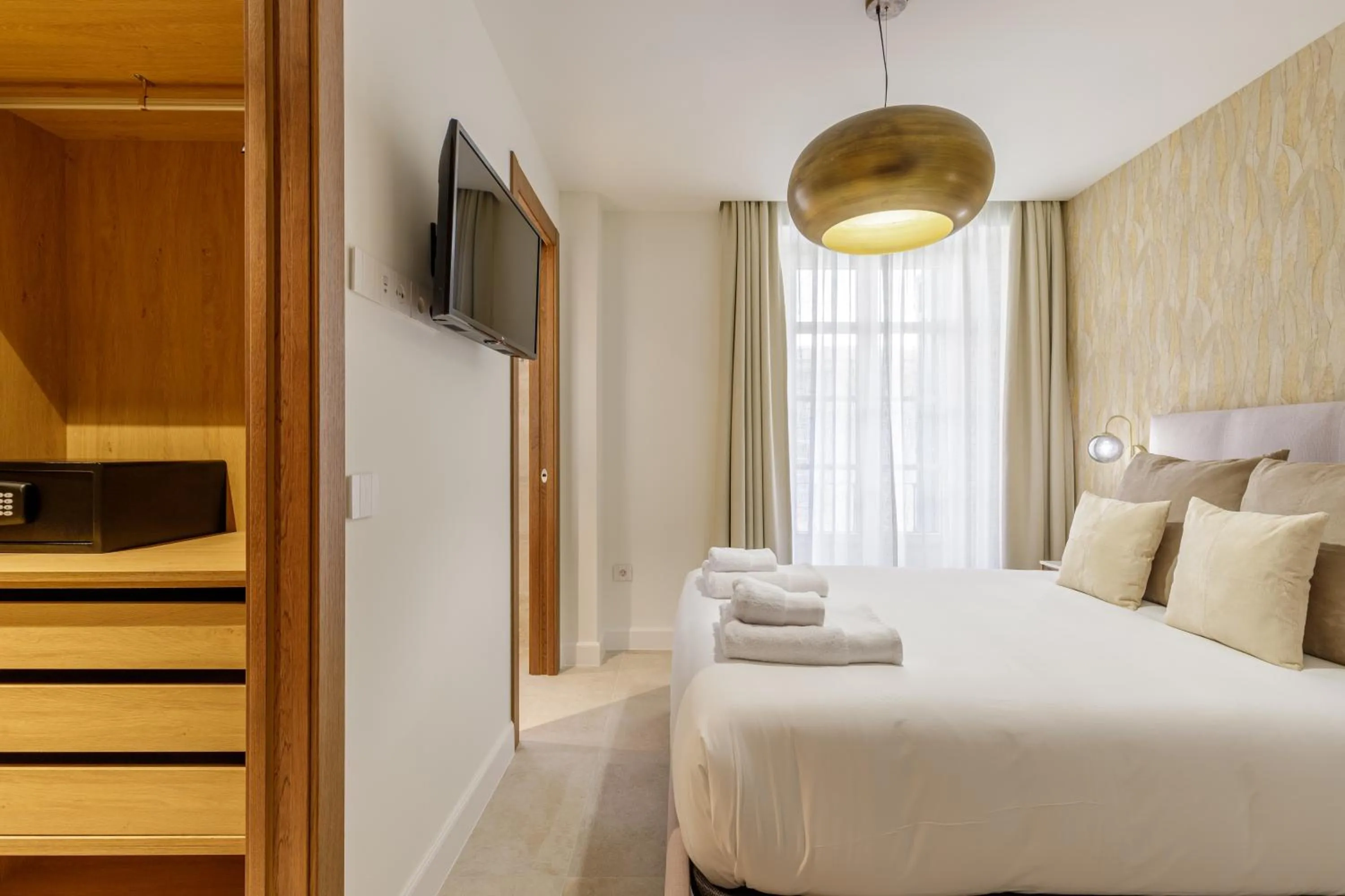 Bed in Plaza del Siglo Suites & Boutique Apartments by Caleta Homes
