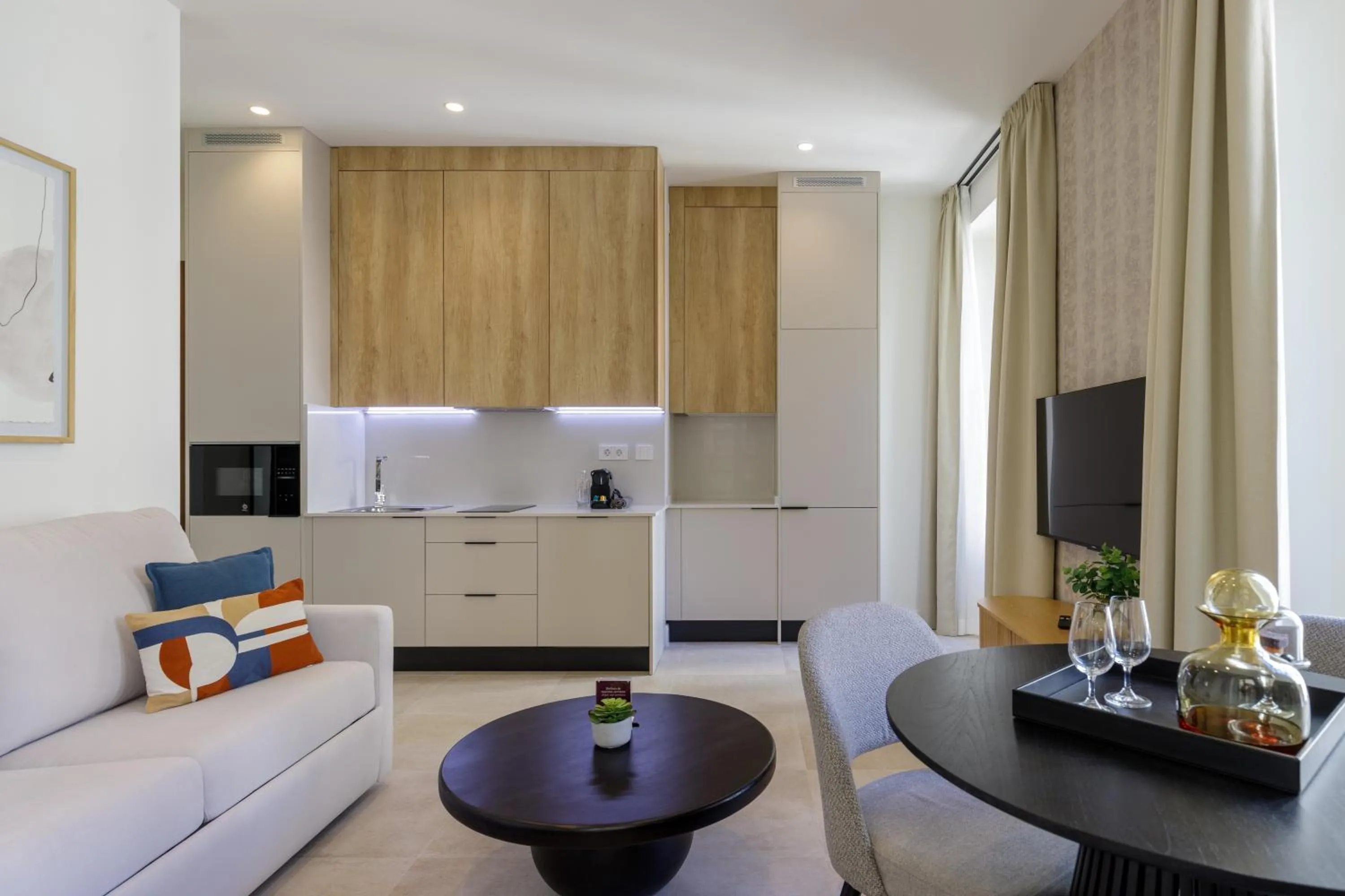 Communal lounge/ TV room in Plaza del Siglo Suites & Boutique Apartments by Caleta Homes