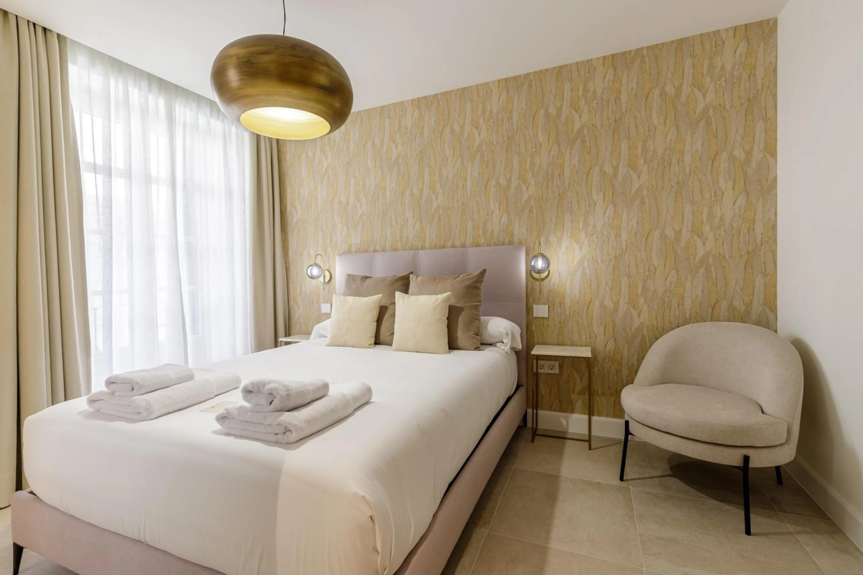 Bed in Plaza del Siglo Suites & Boutique Apartments by Caleta Homes