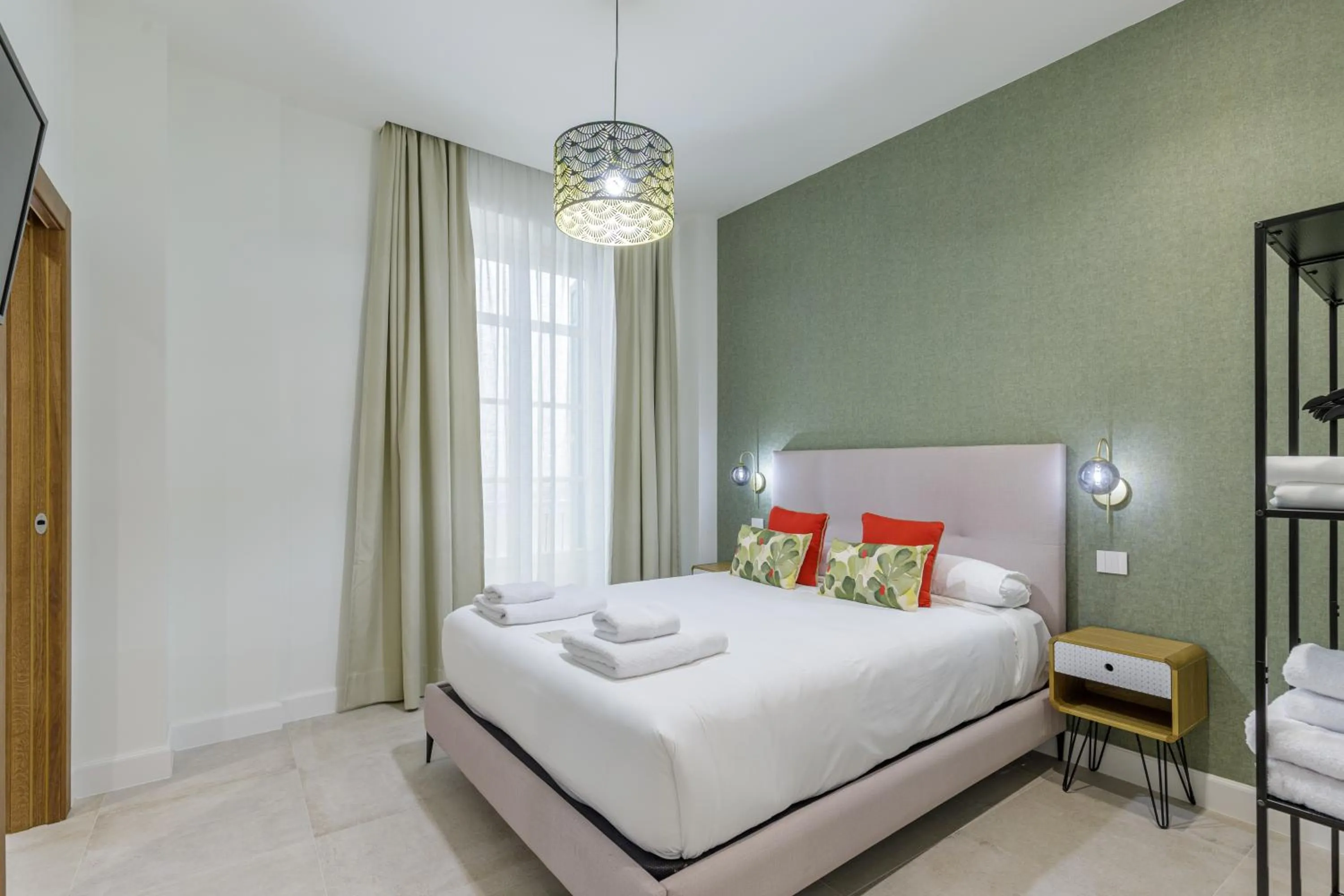 Bed in Plaza del Siglo Suites & Boutique Apartments by Caleta Homes