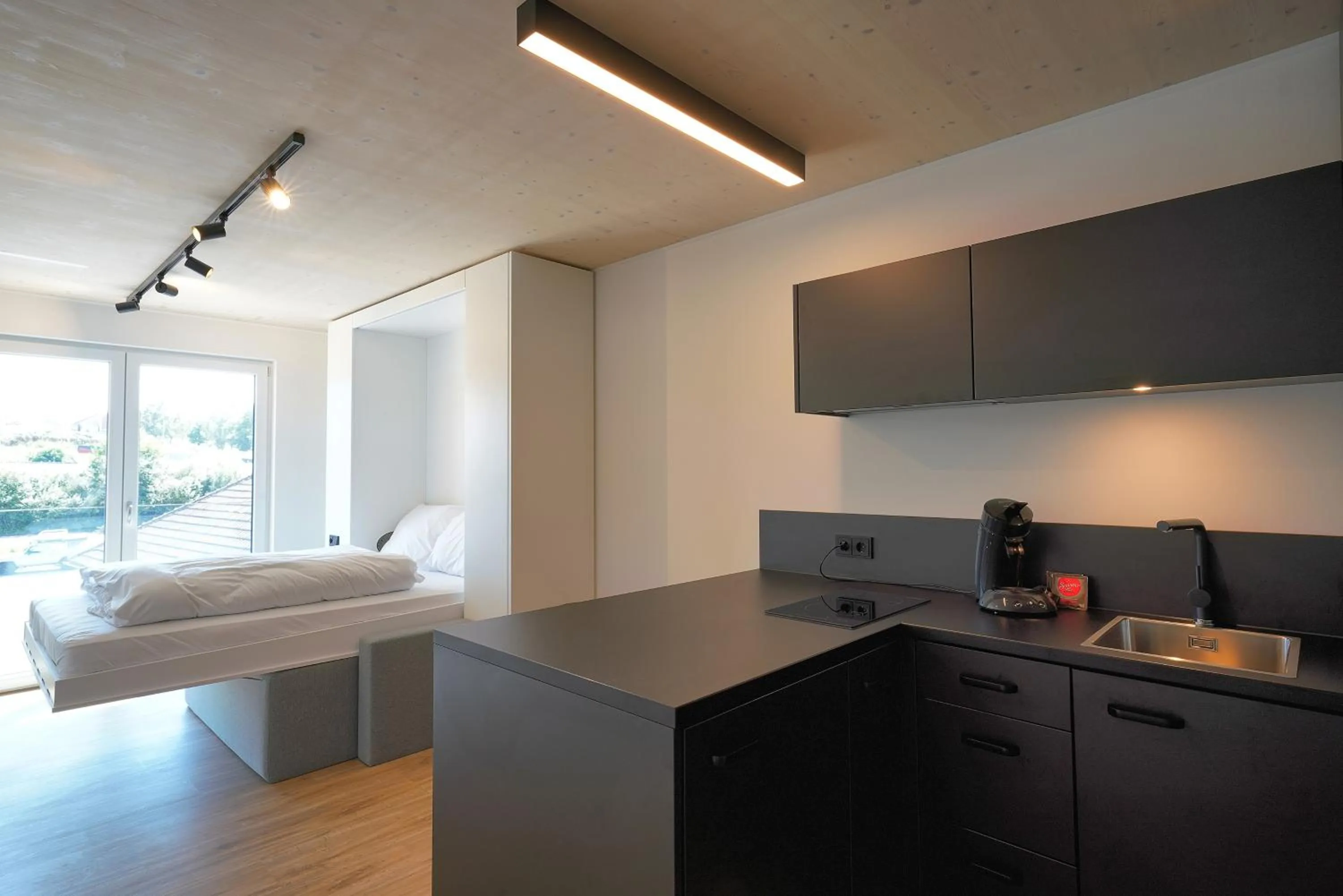 Kitchen or kitchenette, Bed in Timber One Boardinghouse Dorfen