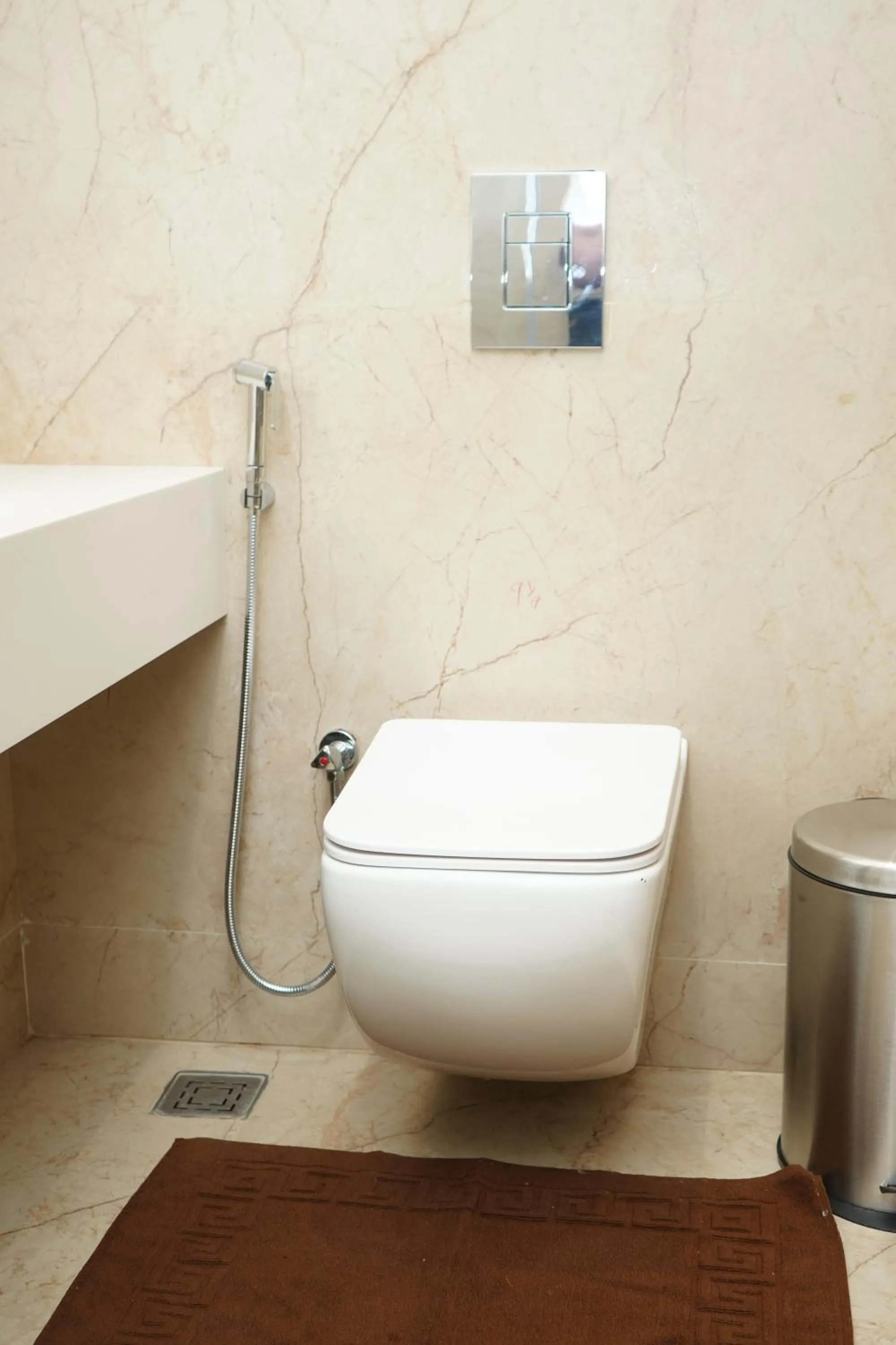 Toilet in VANTARA SUITEs