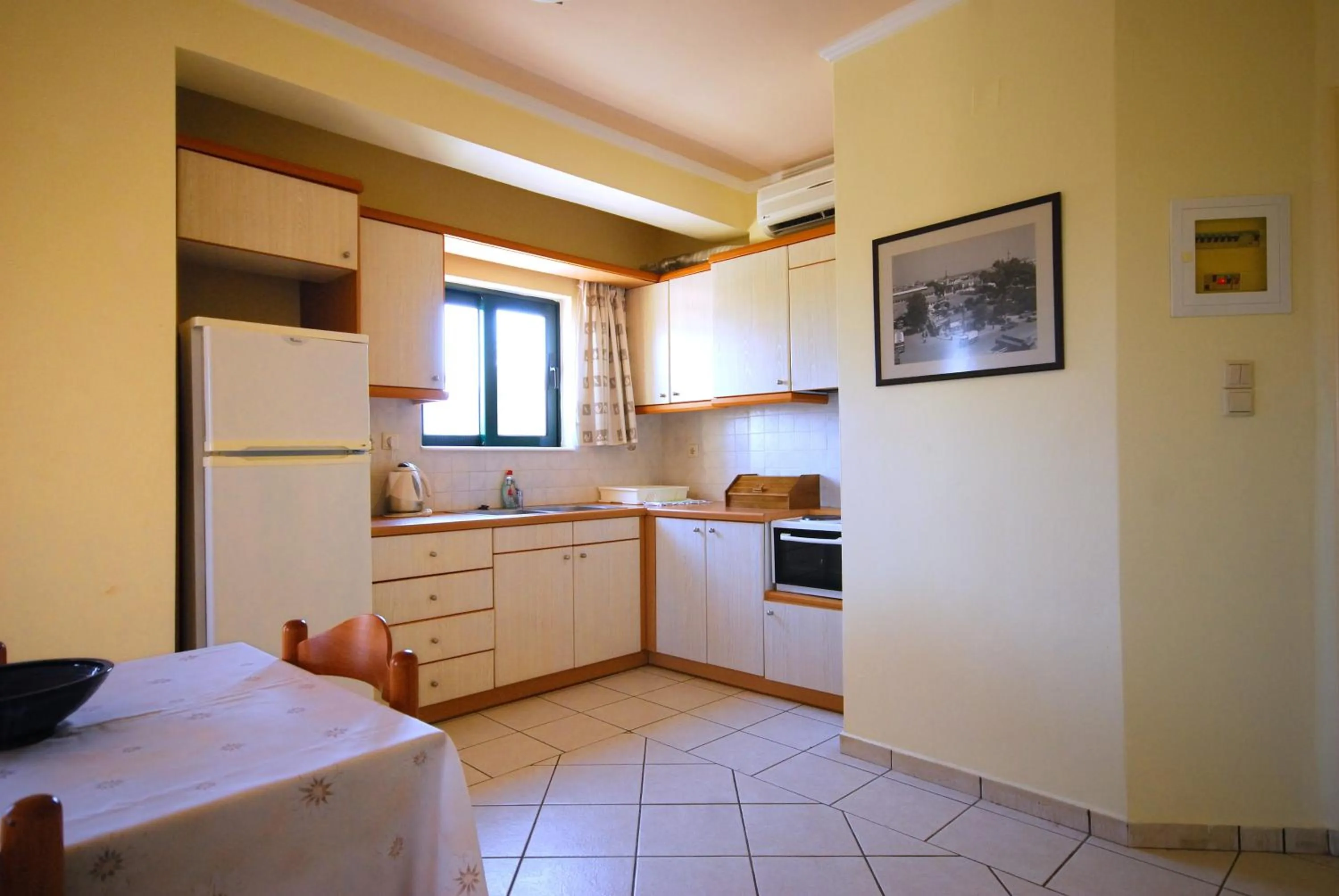 Kitchen or kitchenette, Bed in Aloni Suites