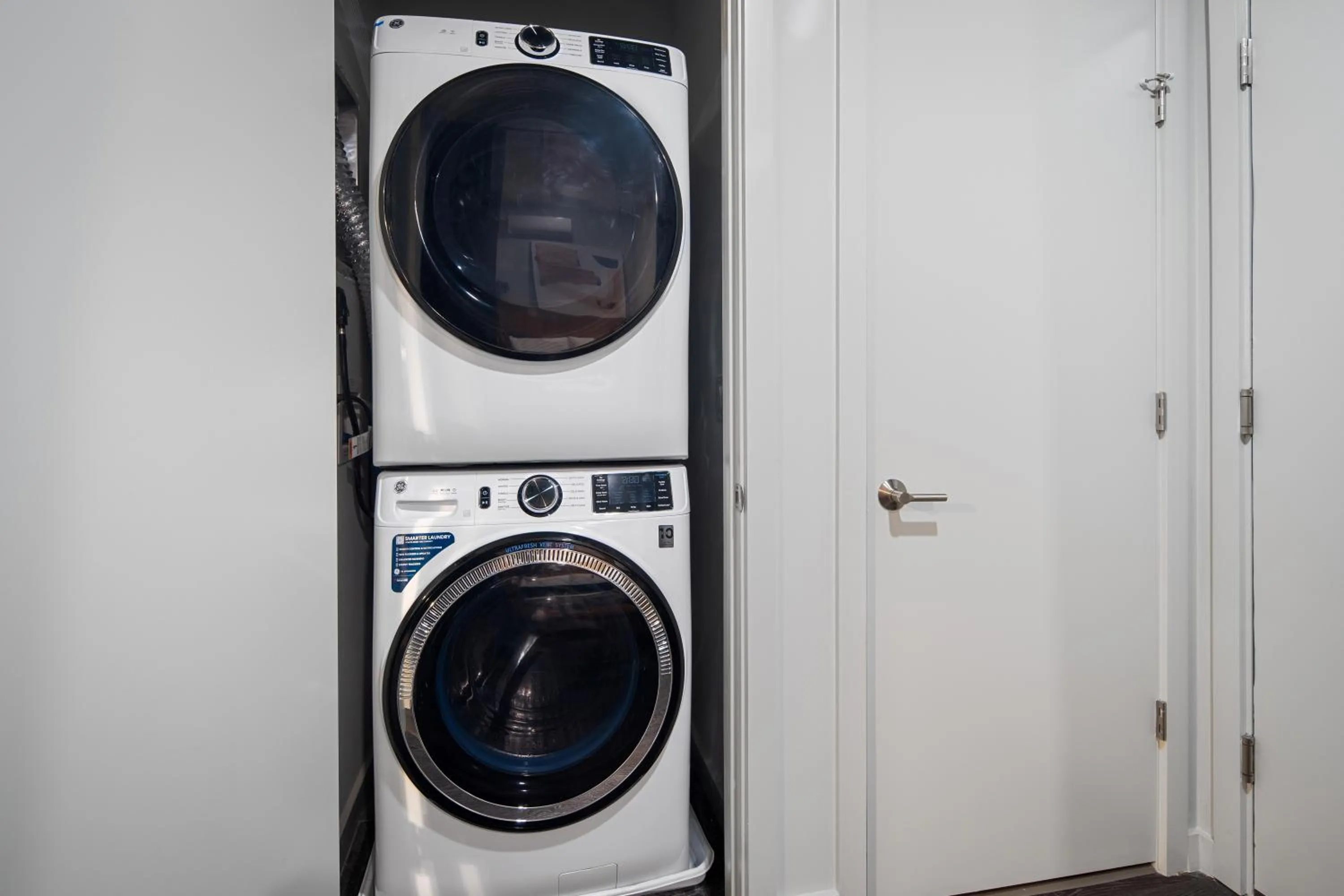 washing machine in Luxury Apartments by Hyatus at The Asher