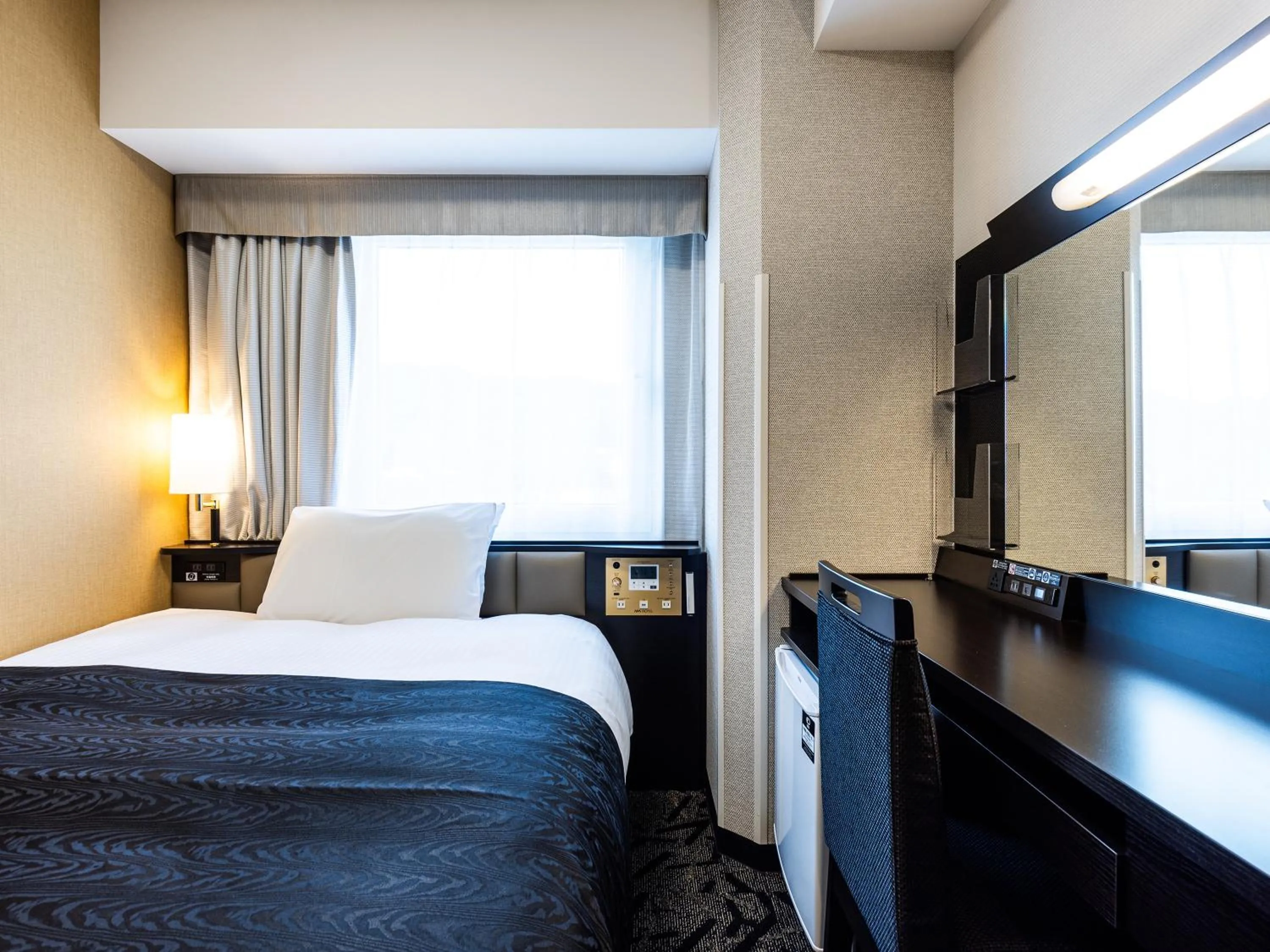 Photo of the whole room, Bed in APA Hotel Hiroshima Ekimae Shinkansenguchi