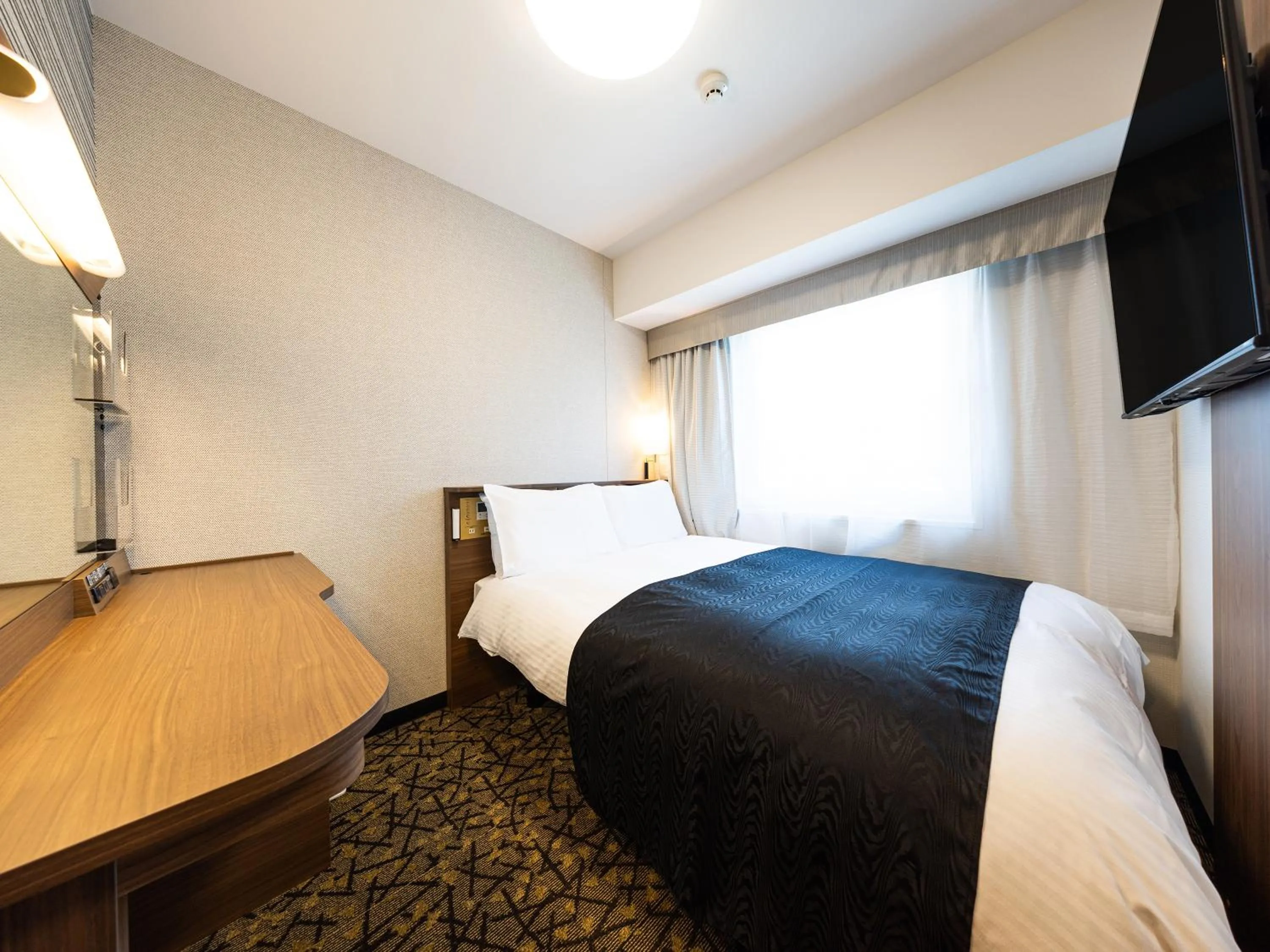 Photo of the whole room, Bed in APA Hotel Hiroshima Ekimae Shinkansenguchi