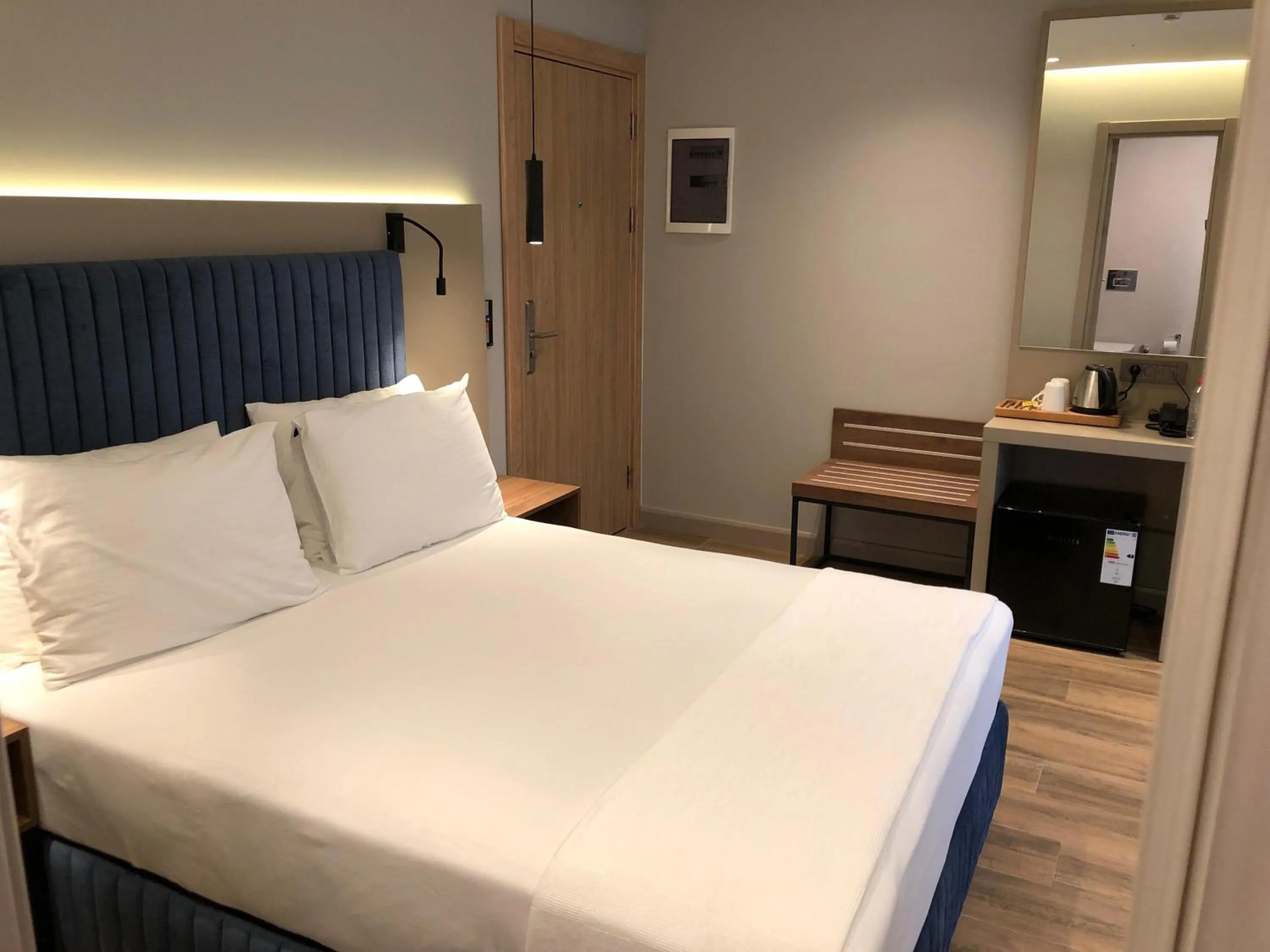 Bed in The Palm Bosphorus Hotel