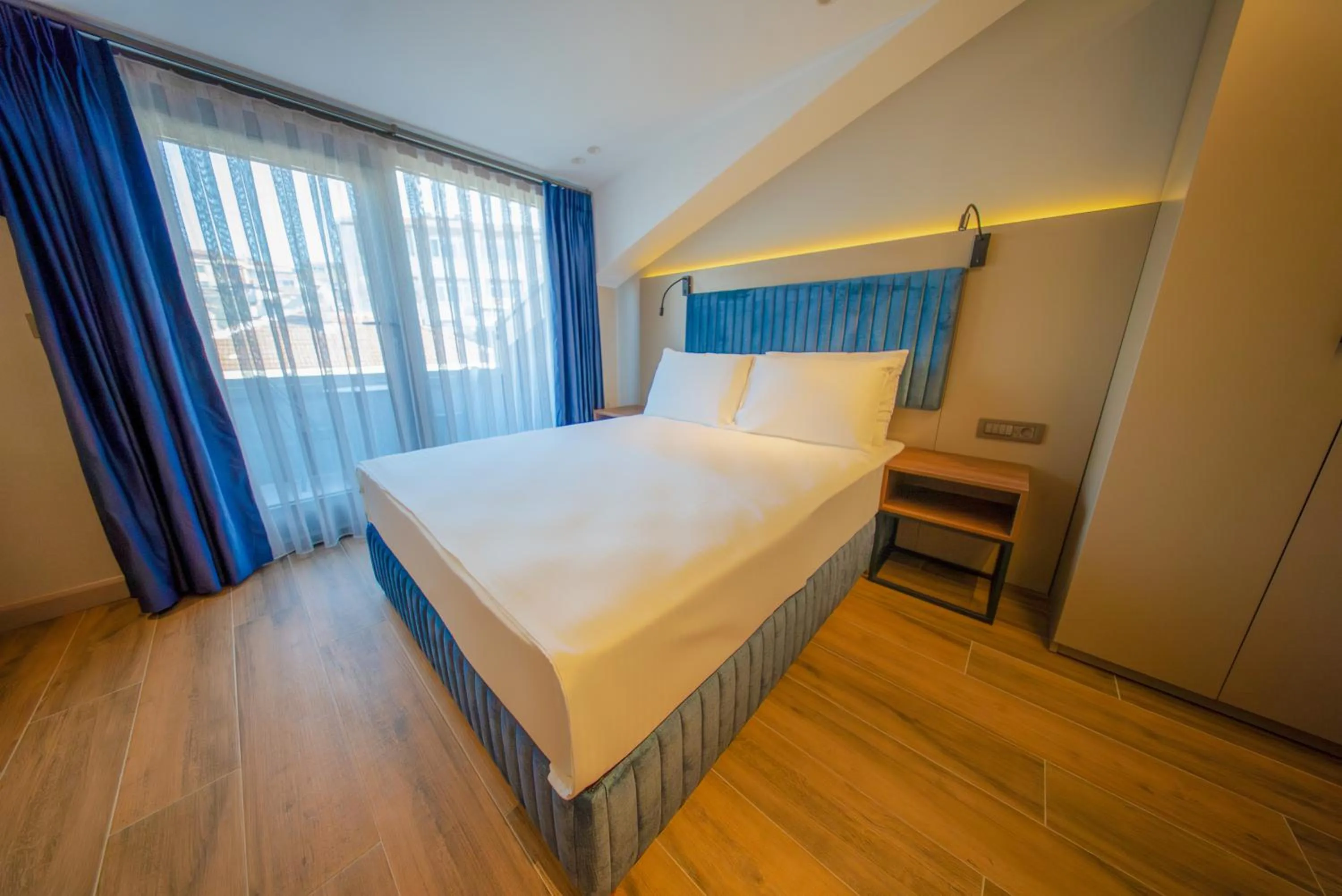 Bed in The Palm Bosphorus Hotel