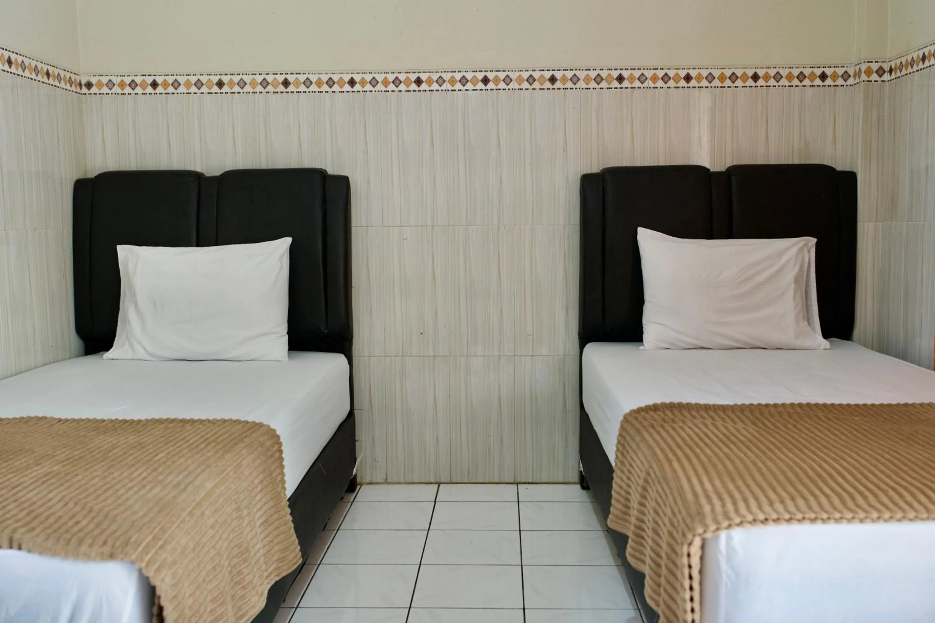 Bed in Garuda Setia Hotel