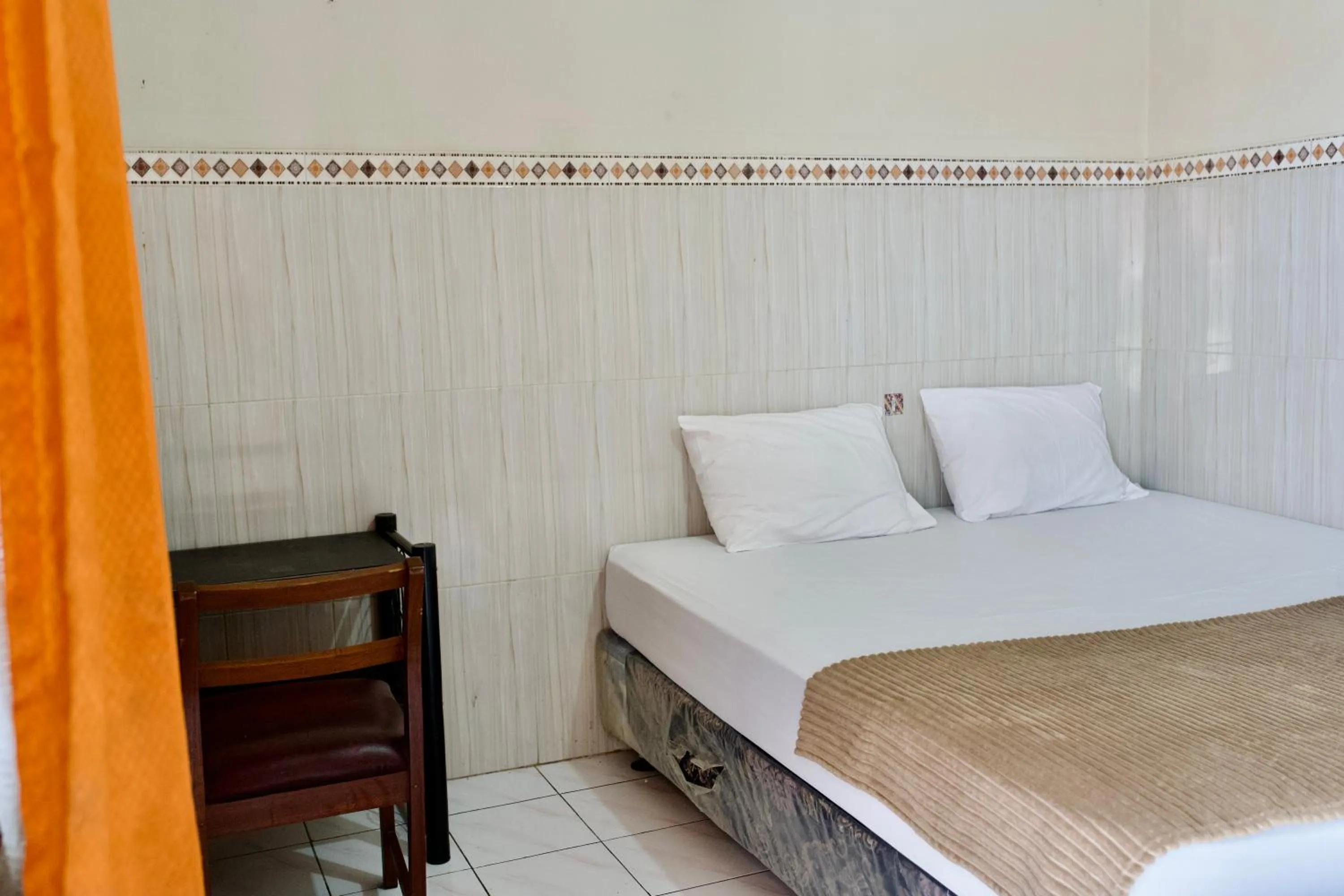 Bed in Garuda Setia Hotel