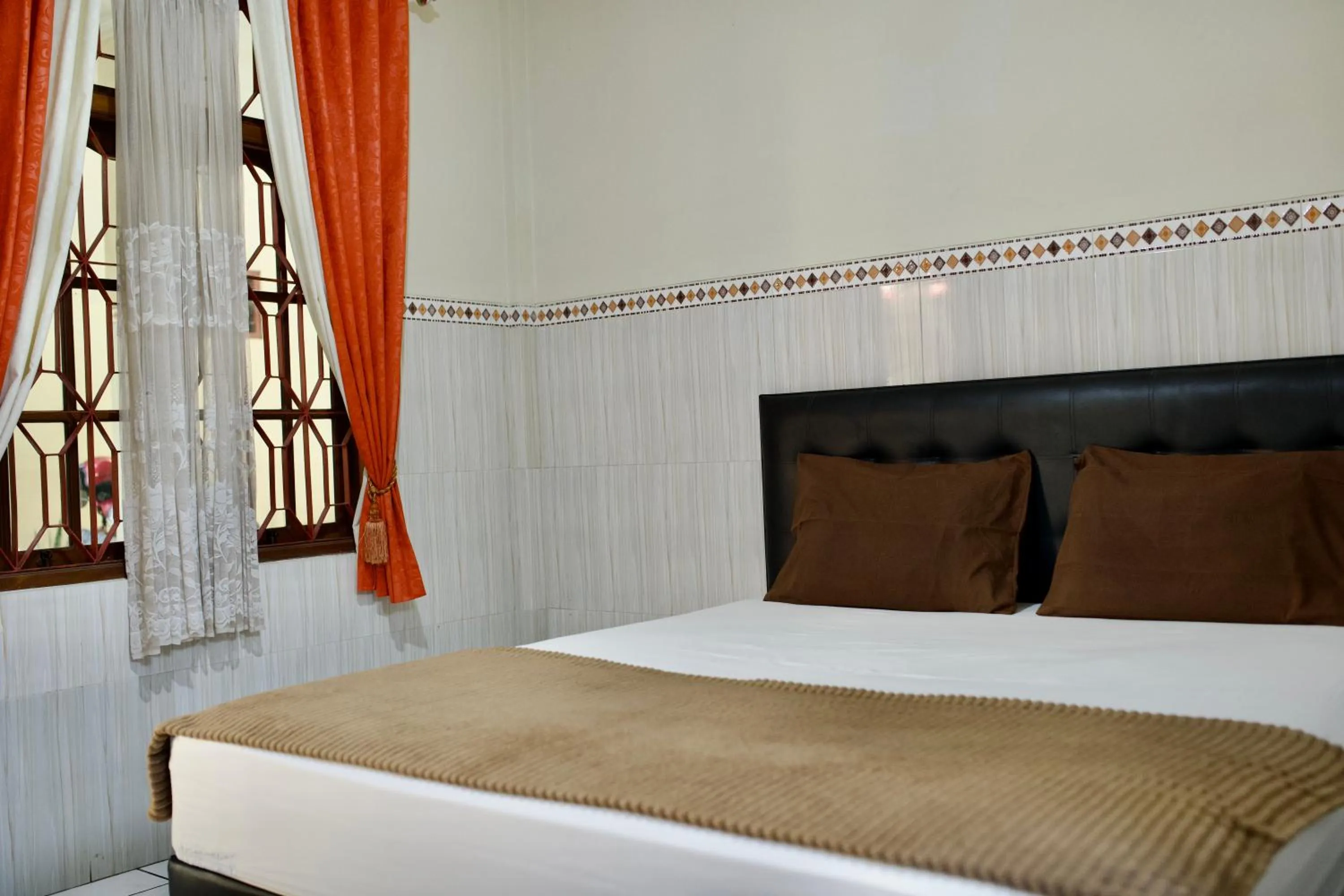 Bed in Garuda Setia Hotel