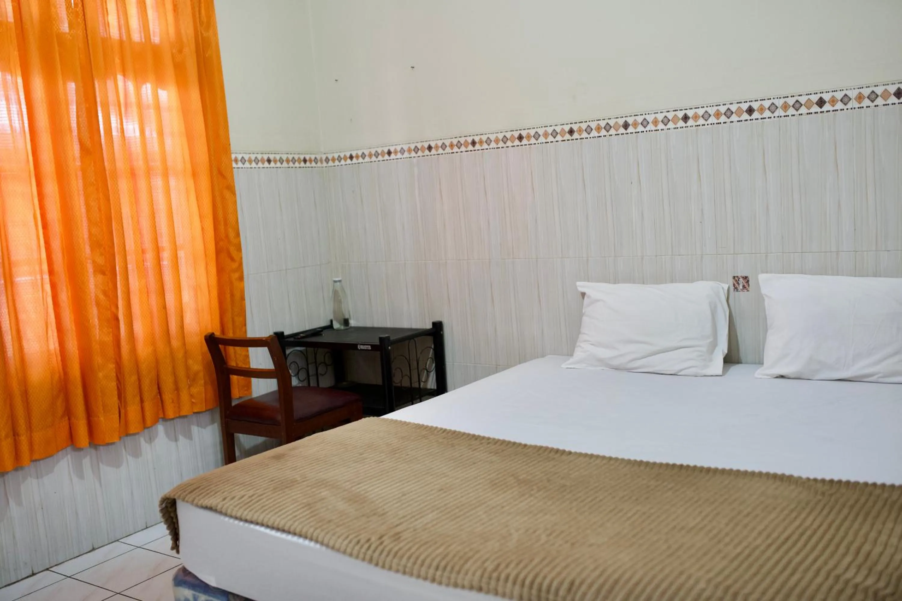 Bed in Garuda Setia Hotel