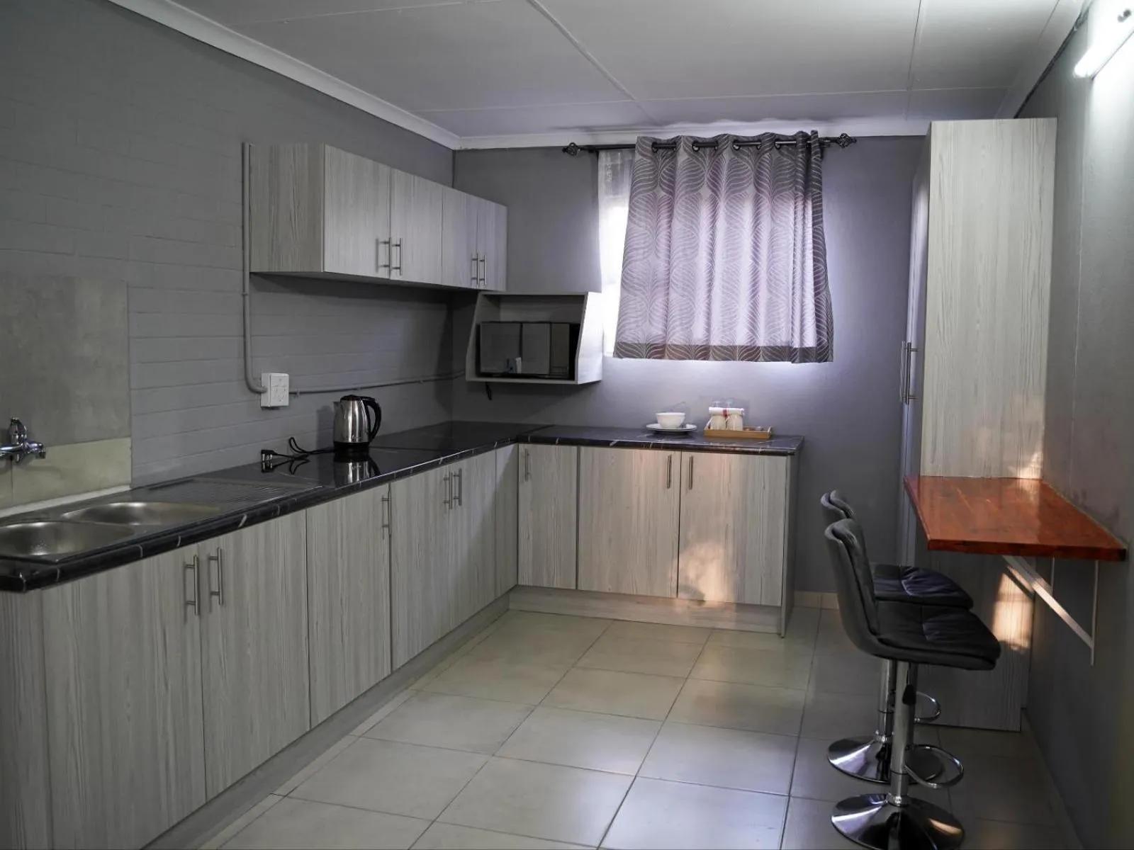 Kitchen or kitchenette in Aqua Guest House