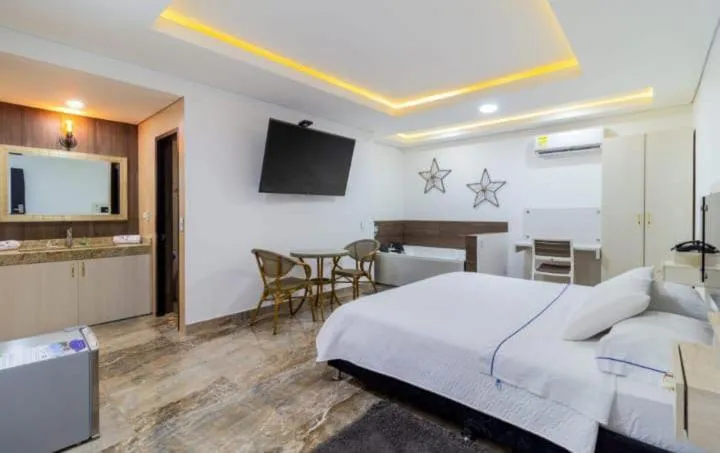 Communal lounge/ TV room, Bed in Hotel deluxe oasis de la colina boutique