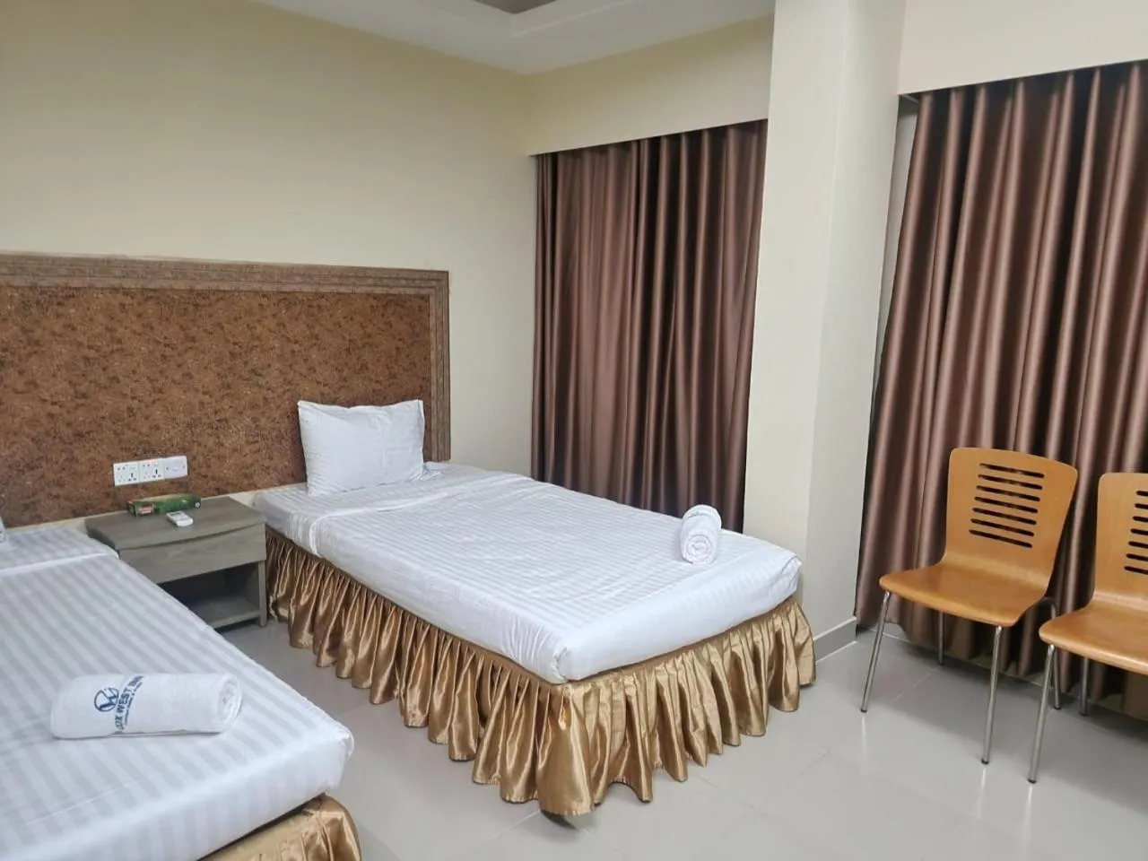 Bed in Cox West Inn