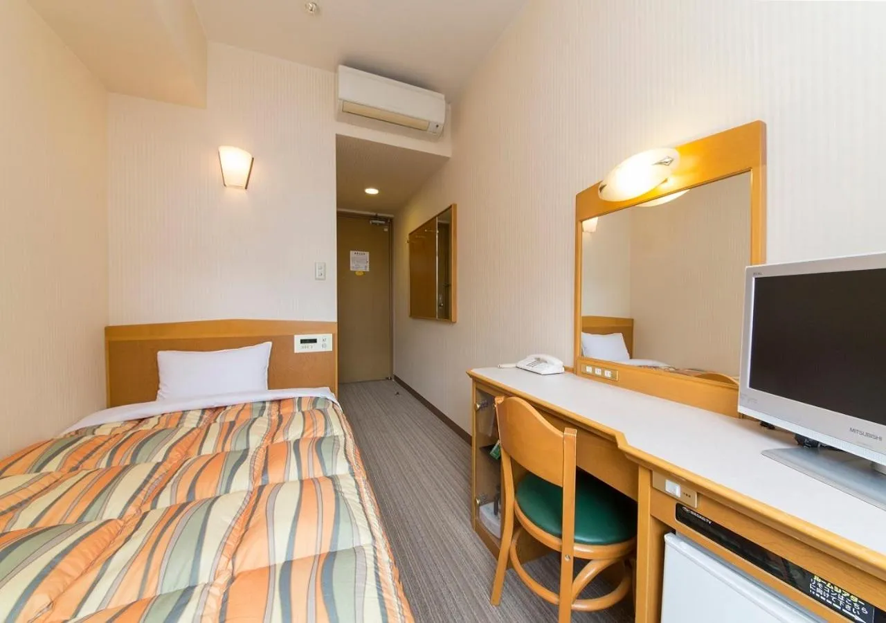 Bed in Nagoya B's Hotel