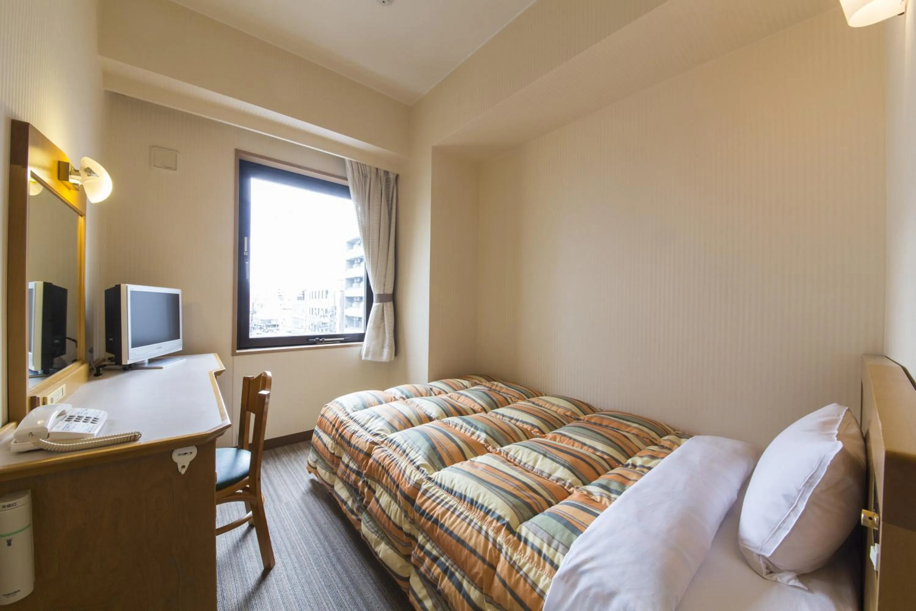 Bed in Nagoya B's Hotel