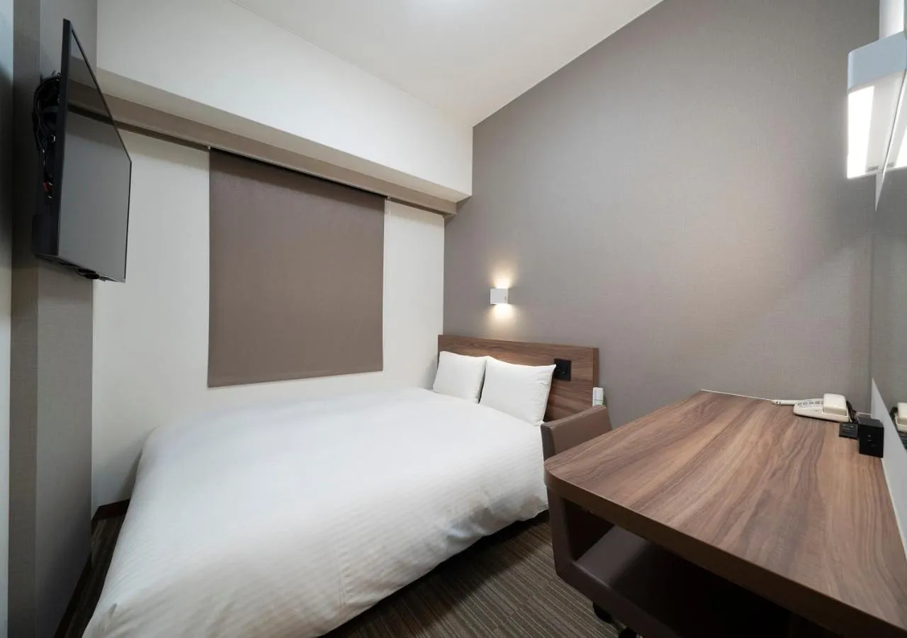 Bed in Nagoya B's Hotel