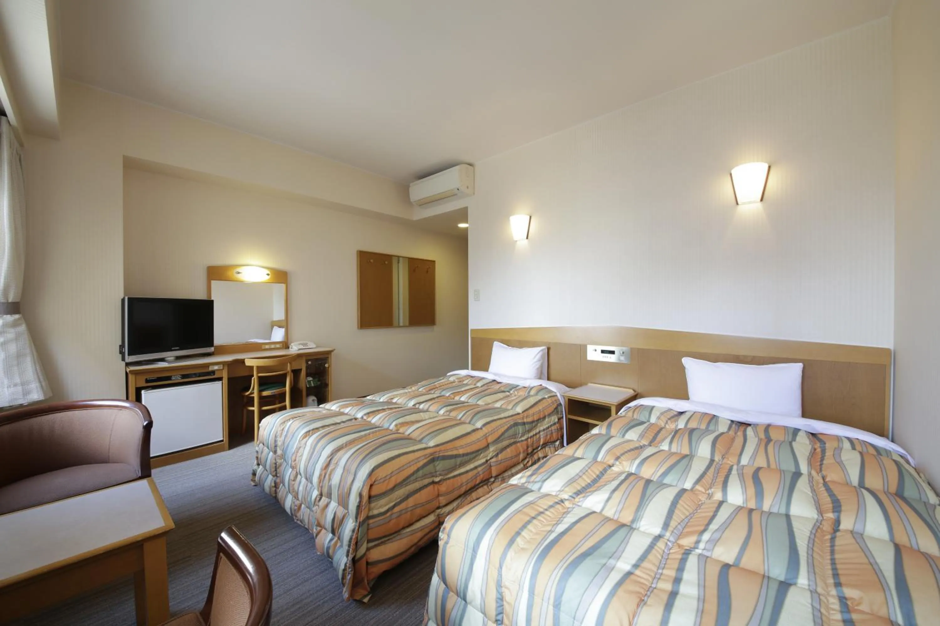 Bed in Nagoya B's Hotel