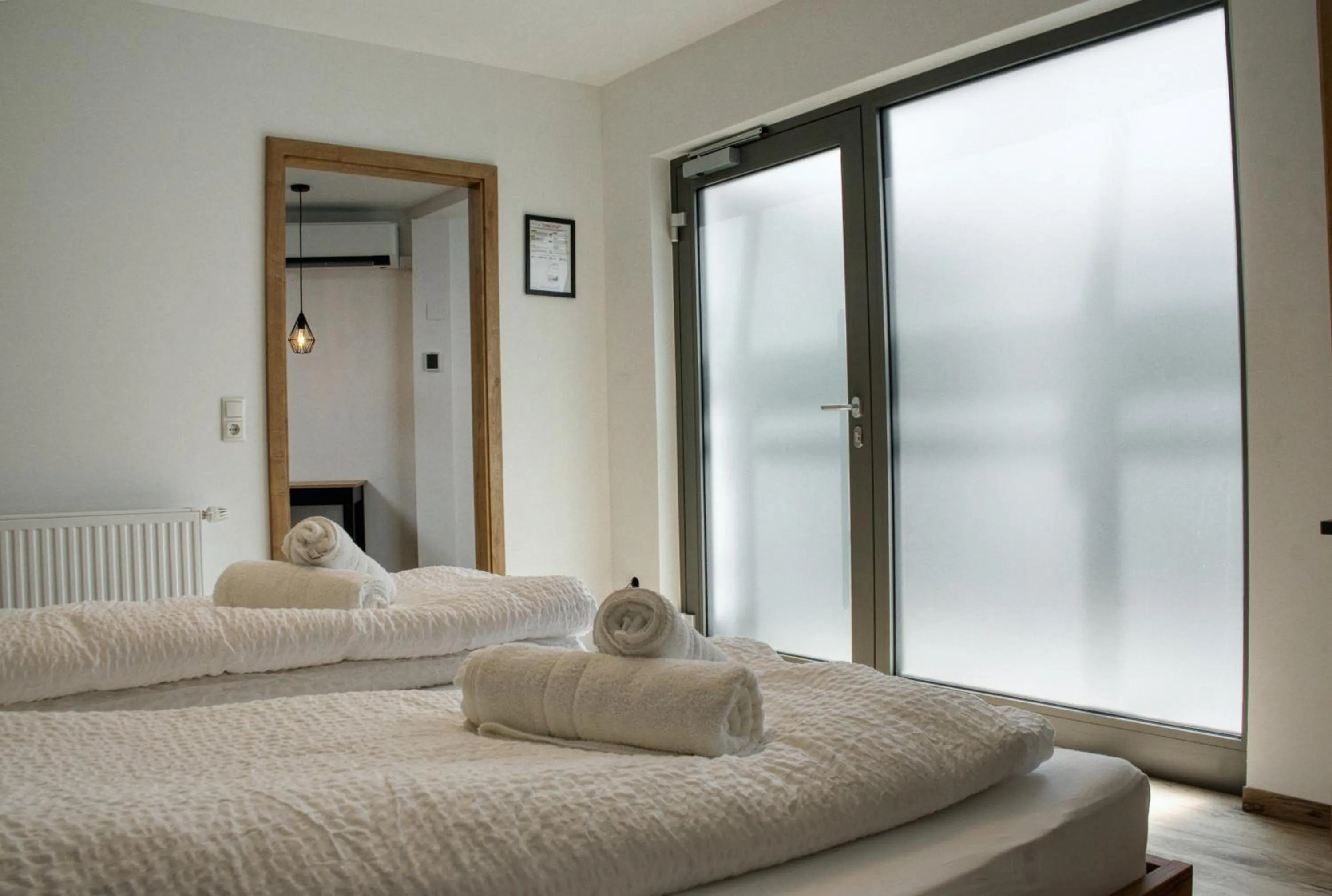 Bed in myQuartier City Chalets digital self check in