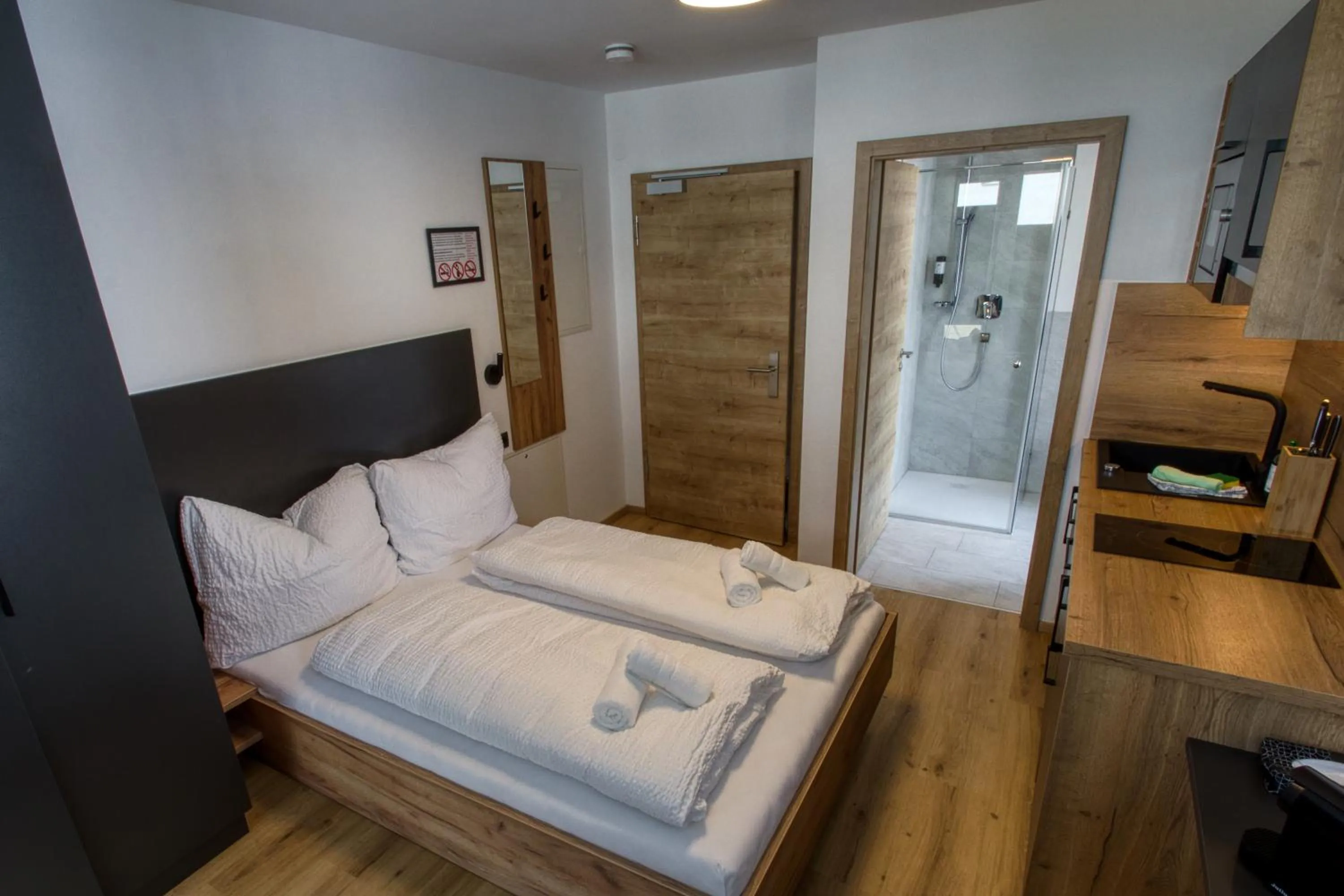 Bed in myQuartier City Chalets digital self check in