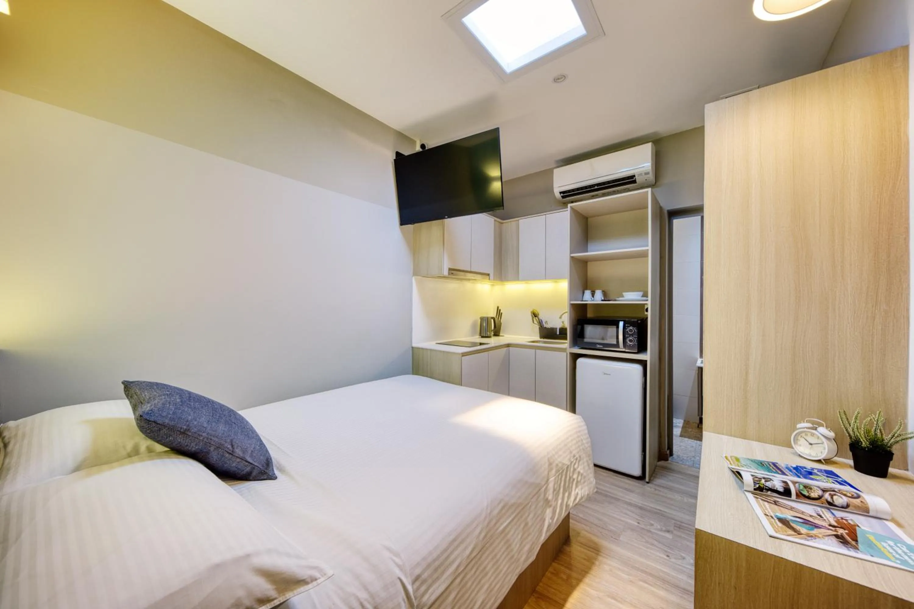 Photo of the whole room, Bed in Habyt Studios Kallang