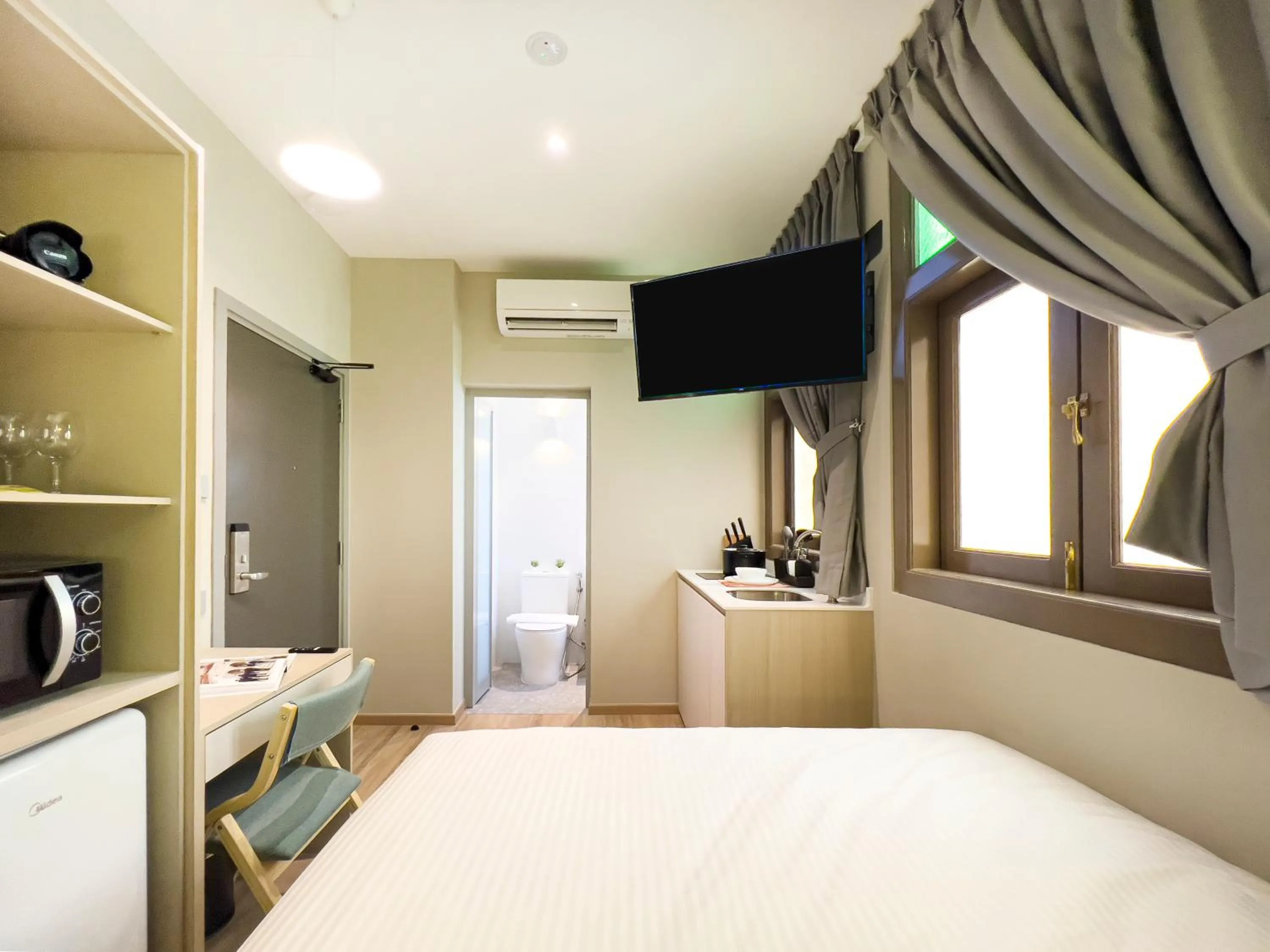 Photo of the whole room, Bed in Habyt Studios Kallang