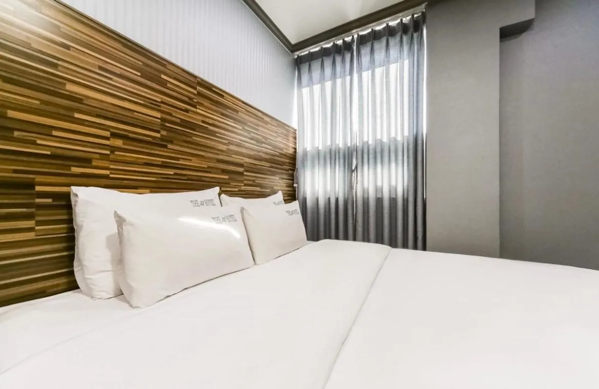 Bed in The Sharp Hotel