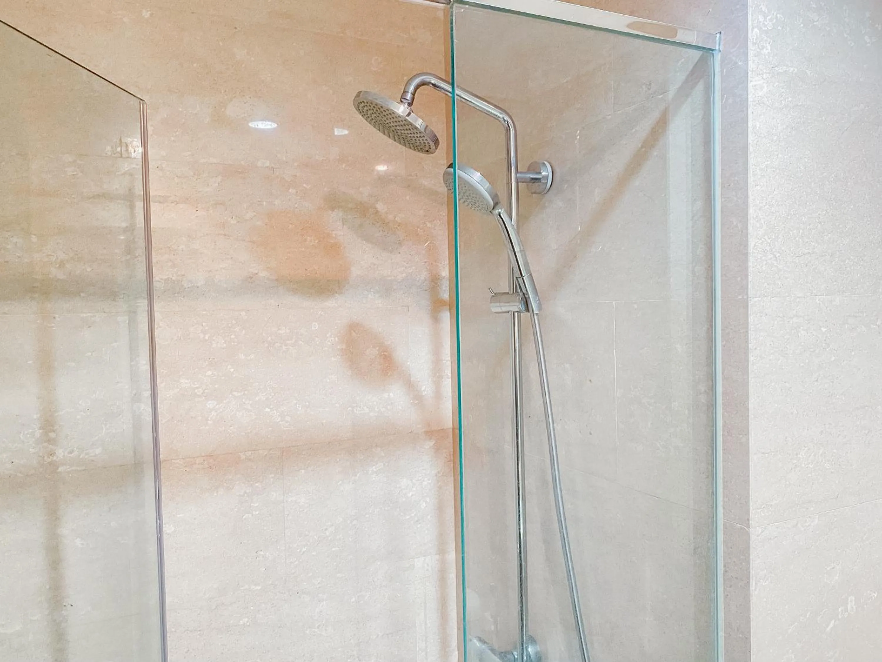 Bathroom in Lovely Studio Menteng Park Apartment By Travelio