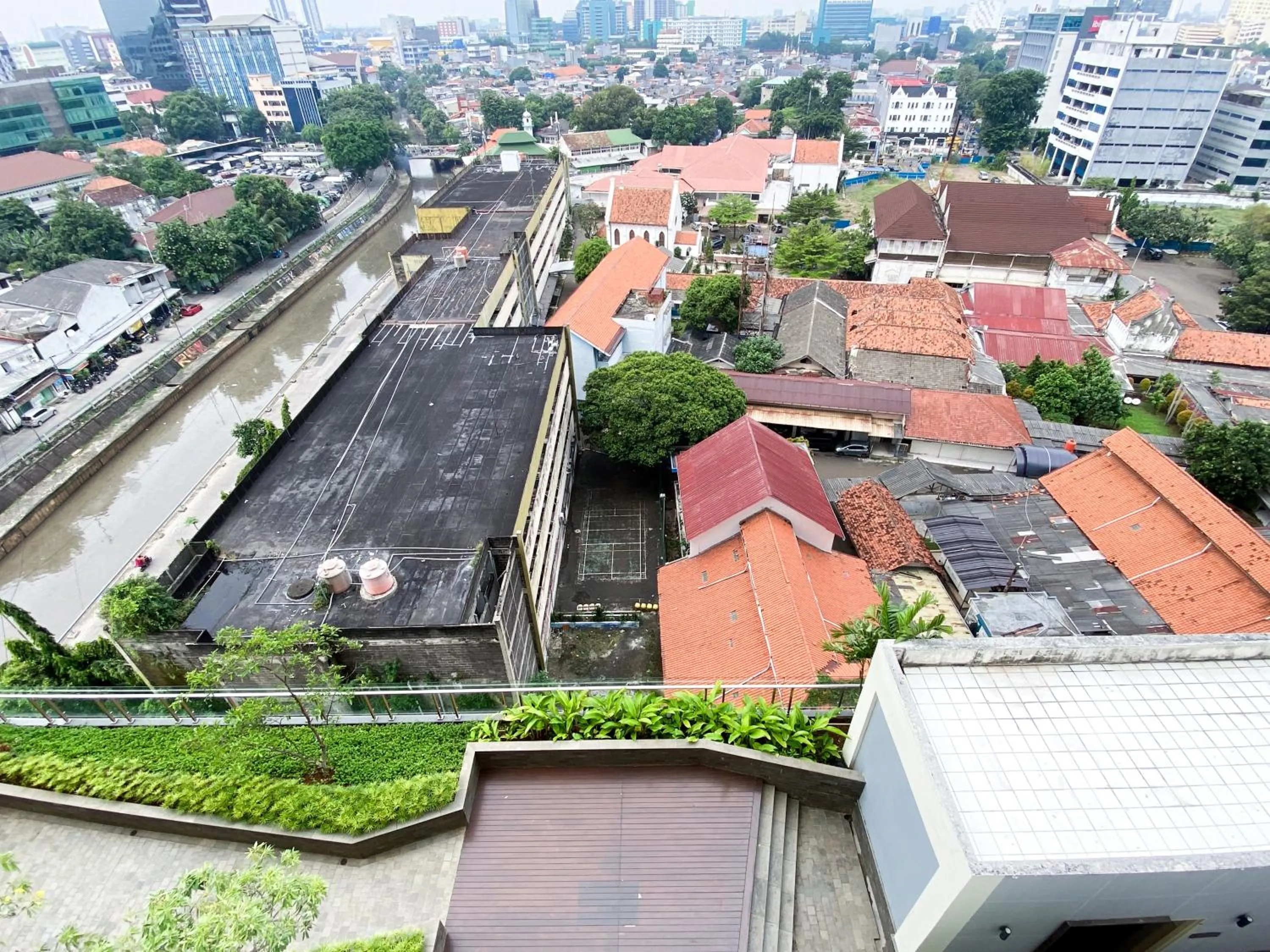 Property building in Lovely Studio Menteng Park Apartment By Travelio