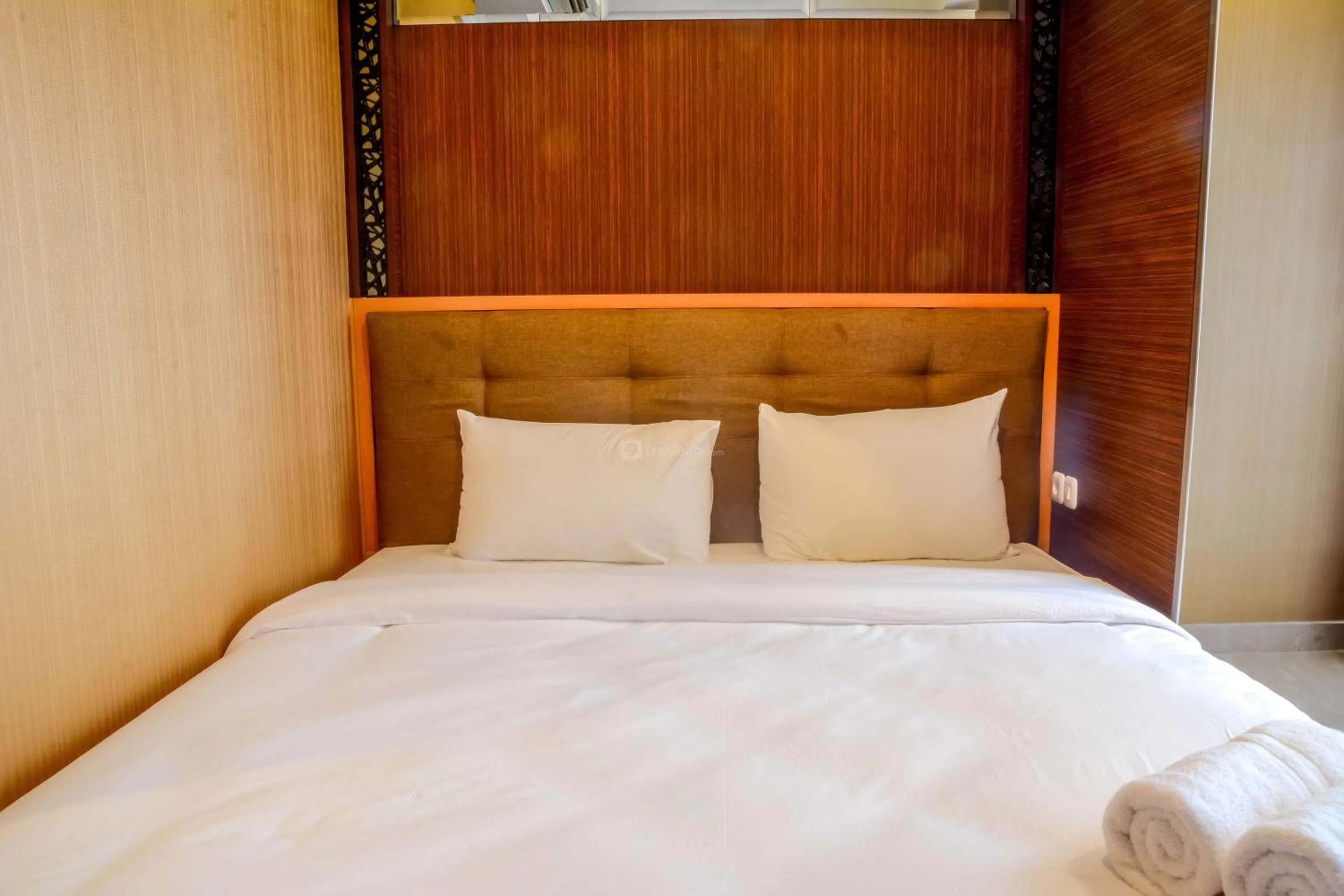 Bed in Lovely Studio Menteng Park Apartment By Travelio