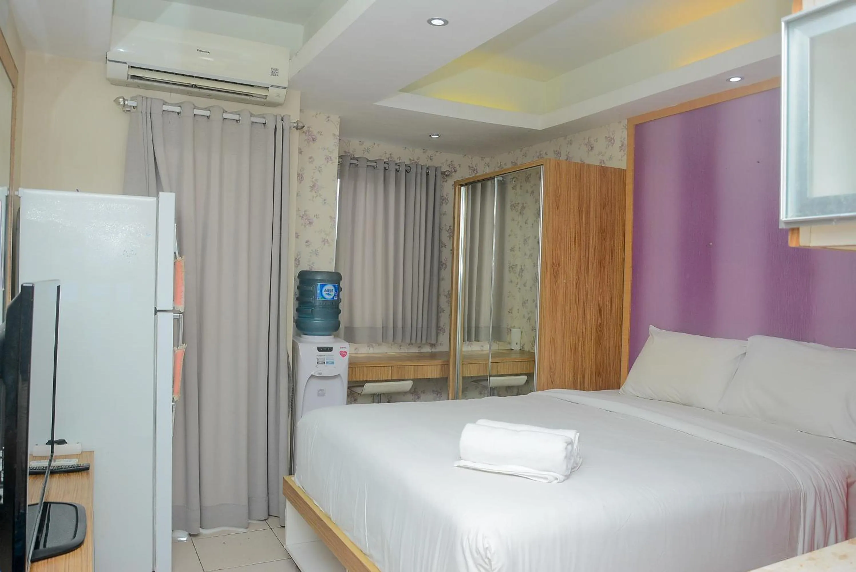 Photo of the whole room, Bed in Homey Studio Pakubuwono Terrace Apartment By Travelio