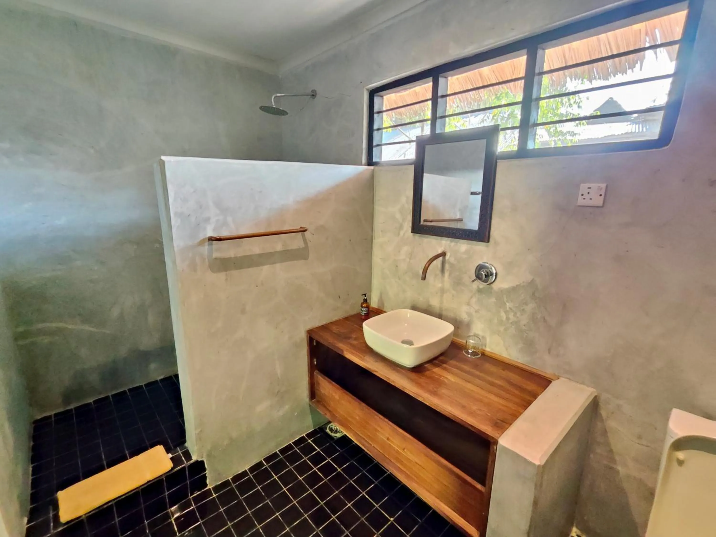 Bathroom in Paje By Night Bungalows