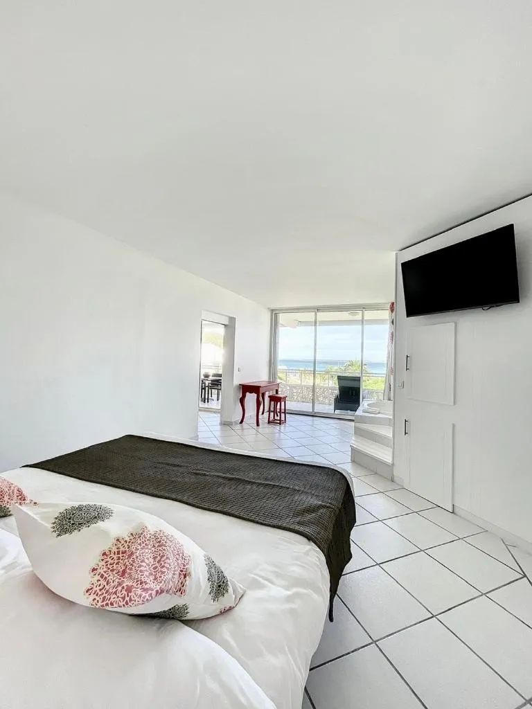 Bed in Le Domaine Anse Marcel Beach Resort