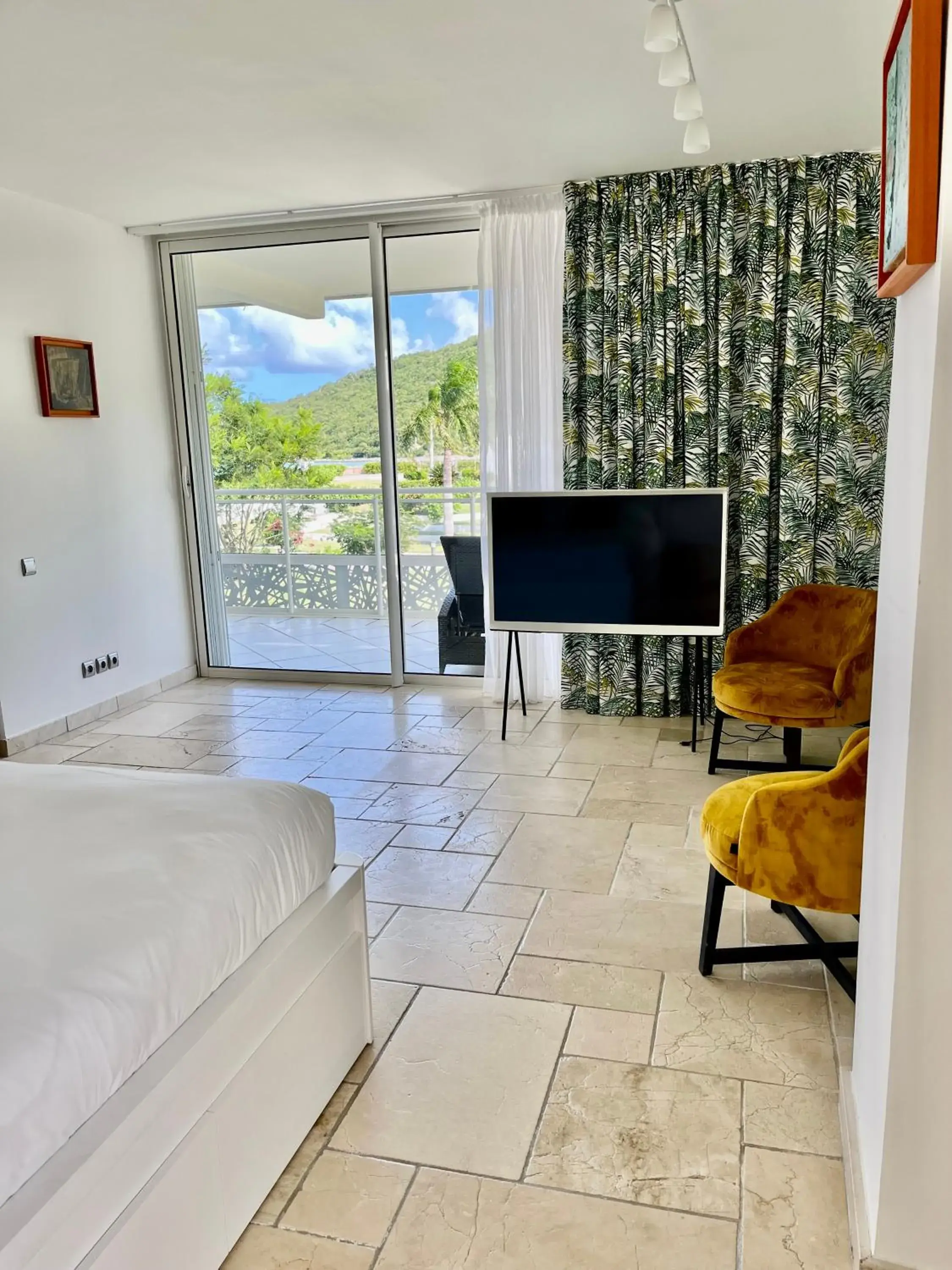 TV and multimedia, Bed in Le Domaine Anse Marcel Beach Resort TV and multimedia, Bed in Le Domaine Anse Marcel Beach Resort